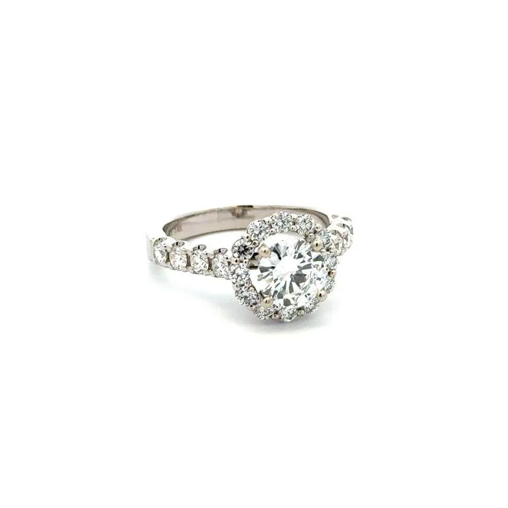Simply Beautiful! Solitaire 1.02 Carat GIA Diamond Gold Ring. Centering a securely nestled Hand set 1.02 Carat Round Brilliant Cut Diamond D-VVS2 GIA. Surrounded by Diamonds, weighing approx. 0.40tcw. Hand crafted 14K White Gold mounting. Ring size