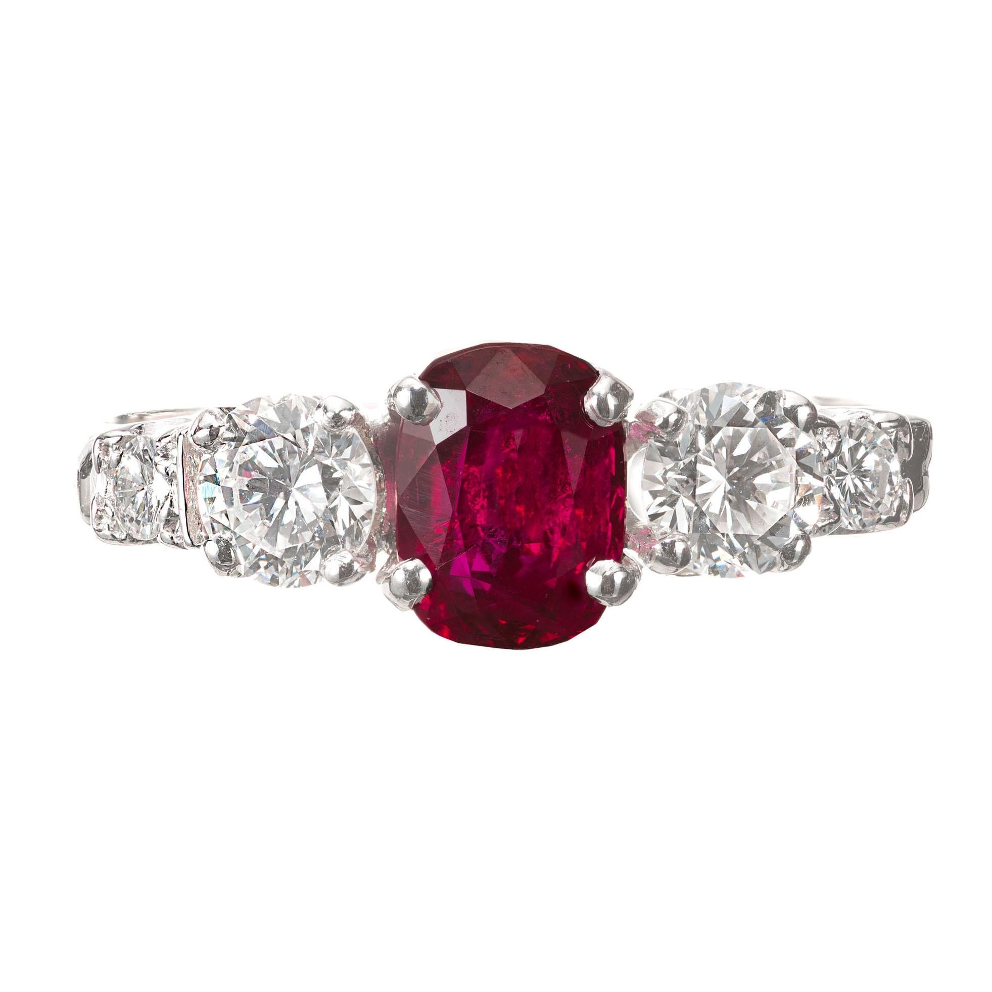 Ruby and diamond engagement ring. GIA certified oval center ruby with 2 round brilliant cut side diamonds and 2 full cut accent diamonds in Platinum setting.  

1 oval bright clear red Ruby, approx. total weight 1.02cts, SI3, 6.3 x 4.7 x 3.5mm, GIA