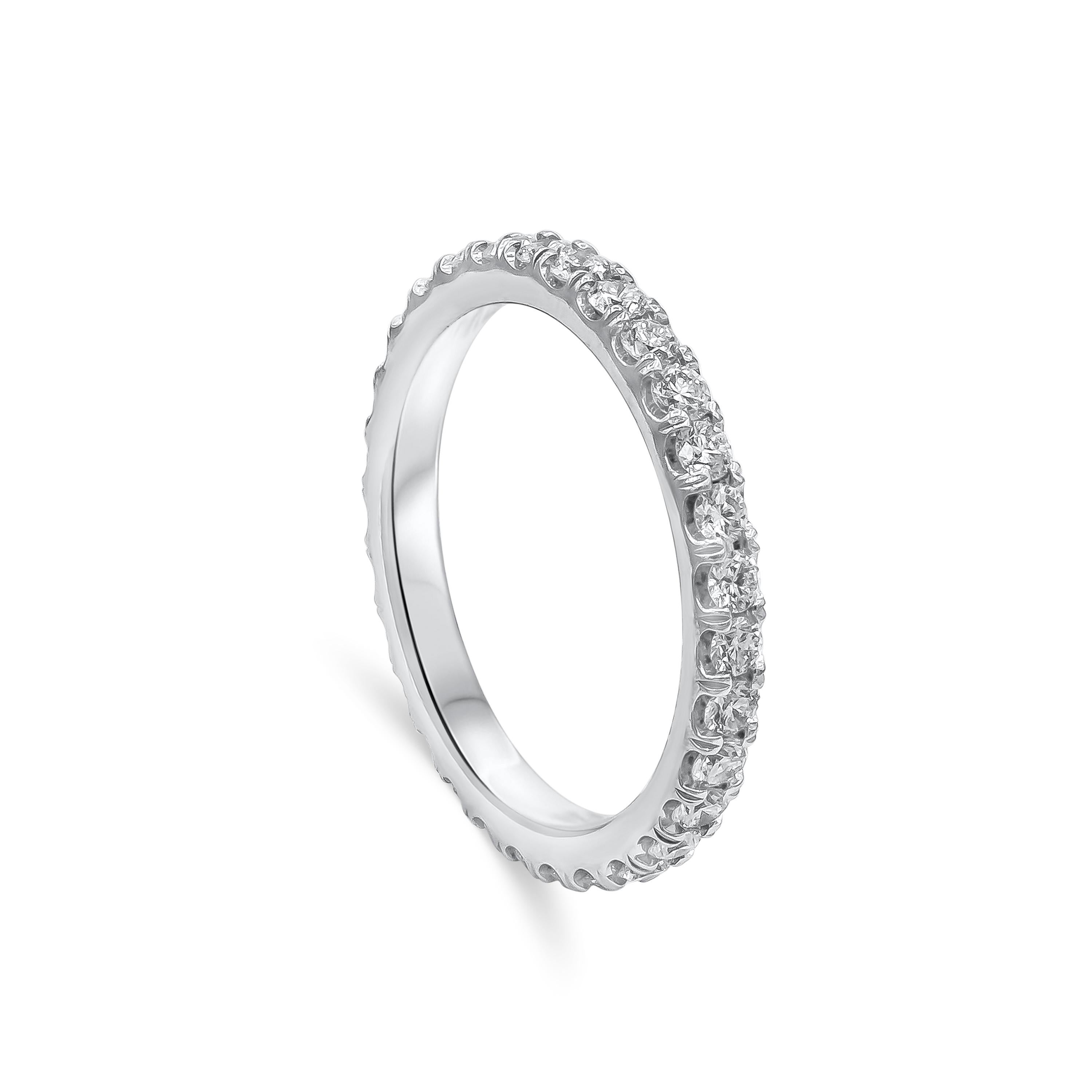 A classic wedding band style showcasing a line of round brilliant diamonds, scalloped pave set in a polished platinum mounting. Diamonds weigh 1.02 carats total. Size 6 US.

Style available in different price ranges. Prices are based on your