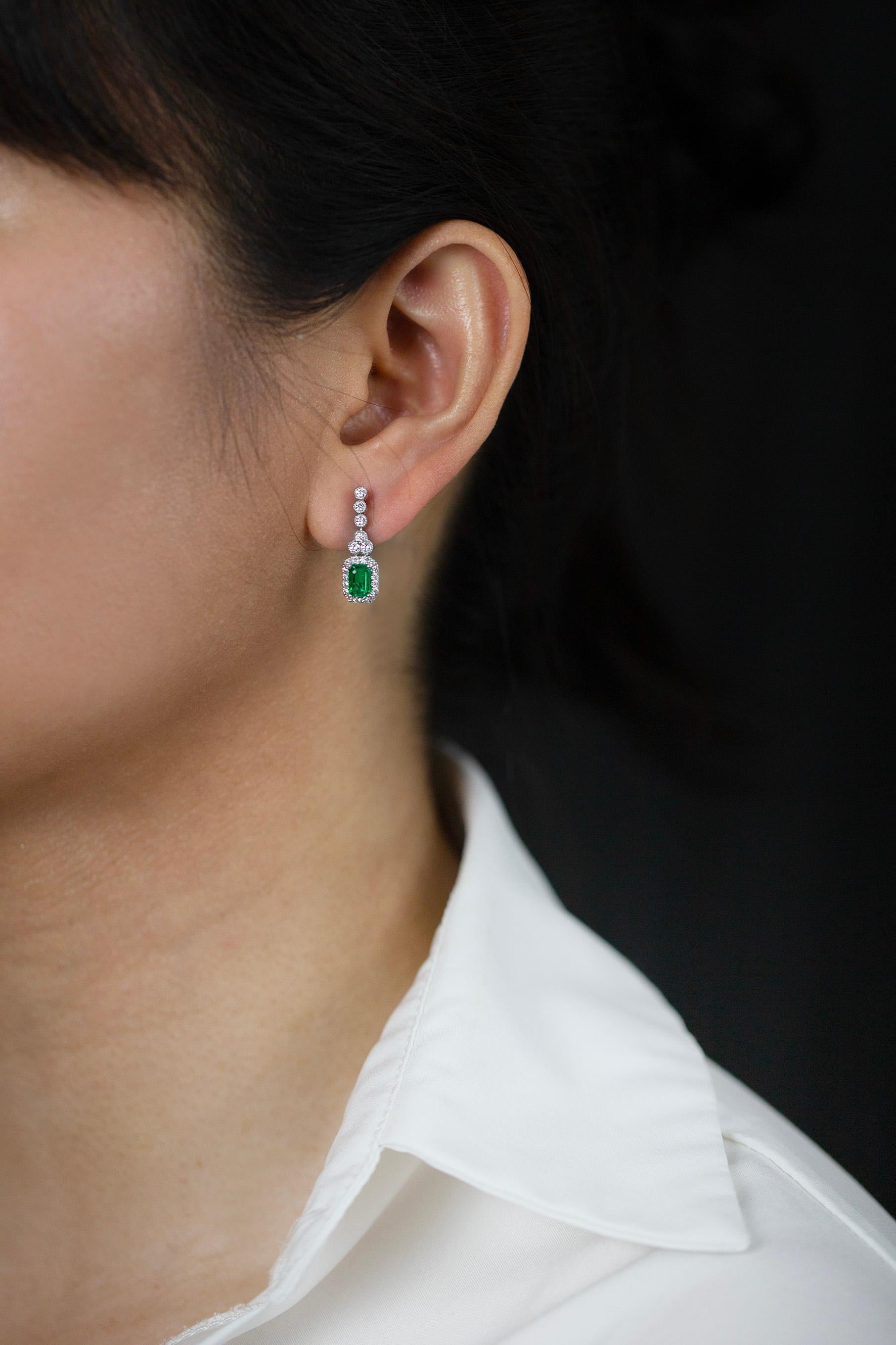 Women's 1.02 Carats Total Emerald Cut Green Emerald & Round Diamond Halo Dangle Earrings For Sale