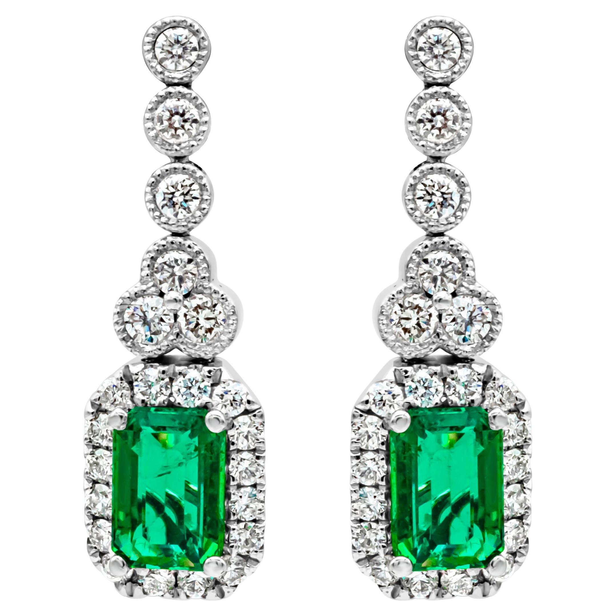1.02 Carats Total Emerald Cut Green Emerald & Round Diamond Halo Dangle Earrings For Sale