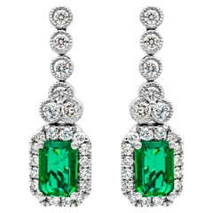 1.02 Carats Total Emerald Cut Green Emerald & Round Diamond Halo Dangle Earrings