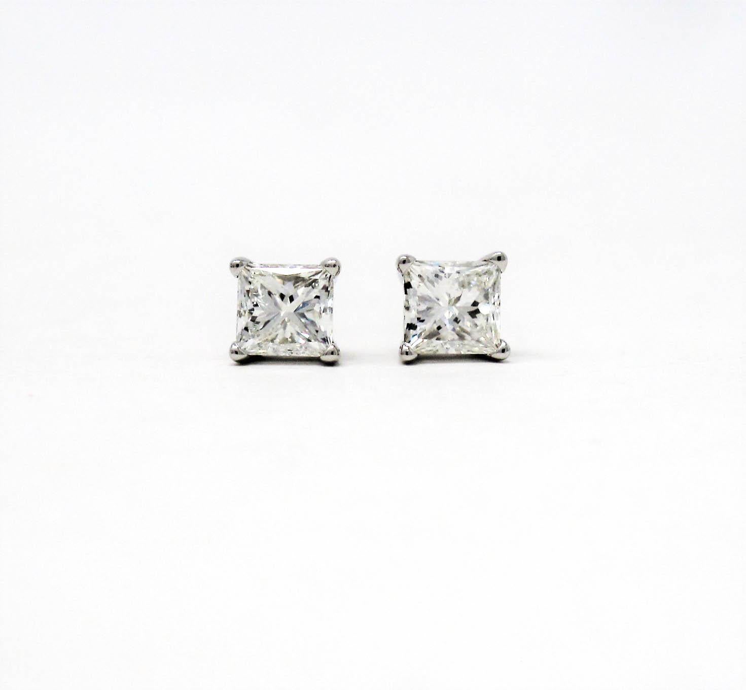 Utterly timeless diamond solitaire stud earrings. These gorgeous square diamond and platinum studs are the epitome of minimalist elegance. The simple yet elegant design can be worn with just about anything, making these your new 'everyday'