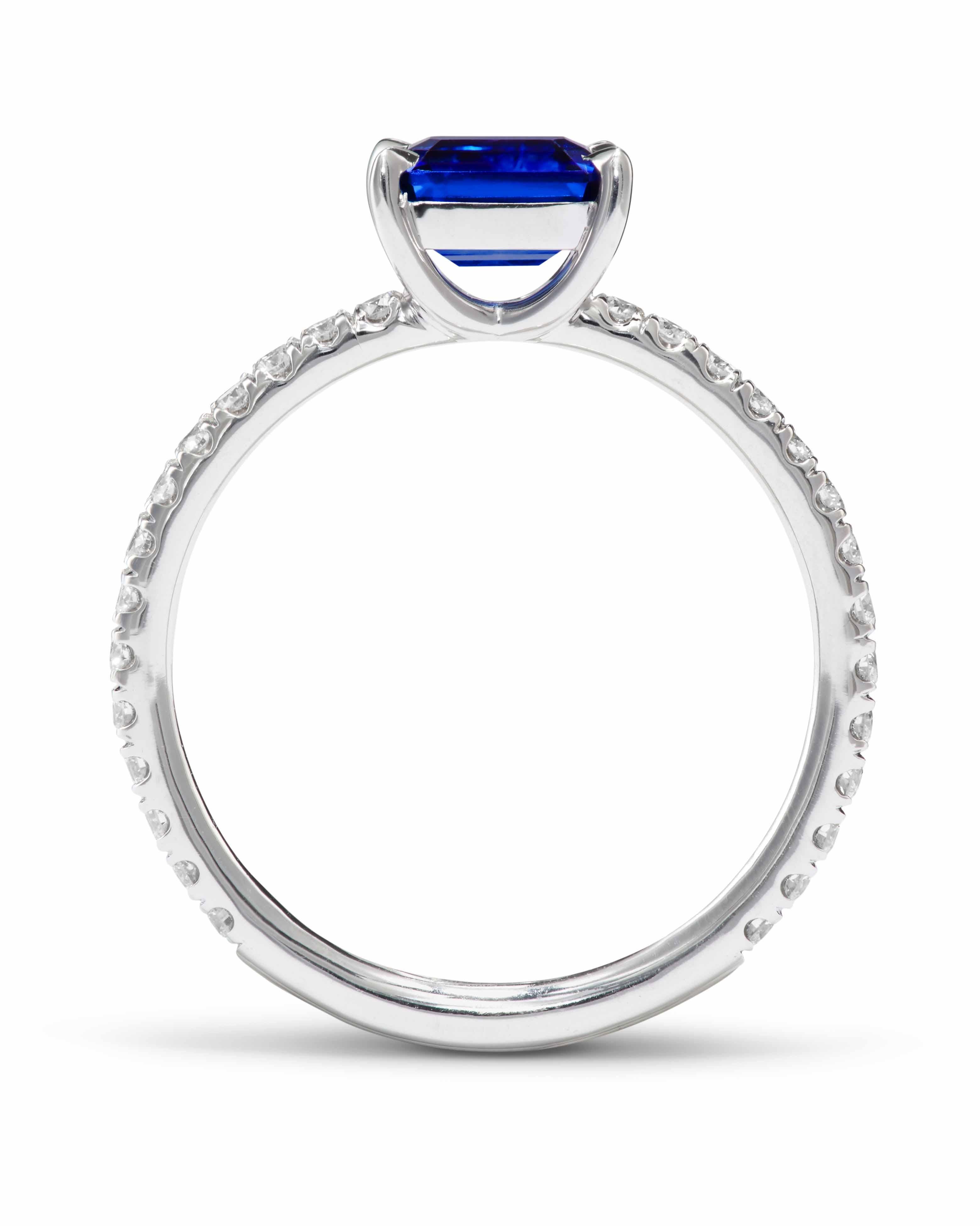 The ring is crafted in 18K white gold and is 2/3 pave-set with 0.32 ct. F/VS brilliant-cut diamonds (ct. weight based on size 6.5). The center stone is a 1.1 ct. vivid blue Sapphire from Sri Lanka.
The width of the band is 1.6 mm. 

Available in