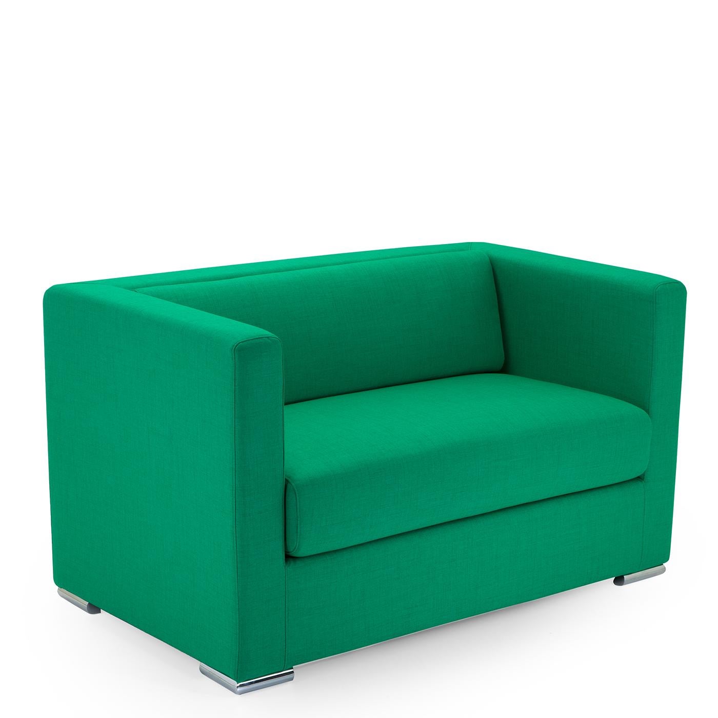 Embodying comfort and functionality, the well-defined rectangular shape and square armrest of this box-like sofa are covered in a stunning seafoam-colored Dacron. The plywood frame is entirely padded with multi-density, cold-injected polyurethane