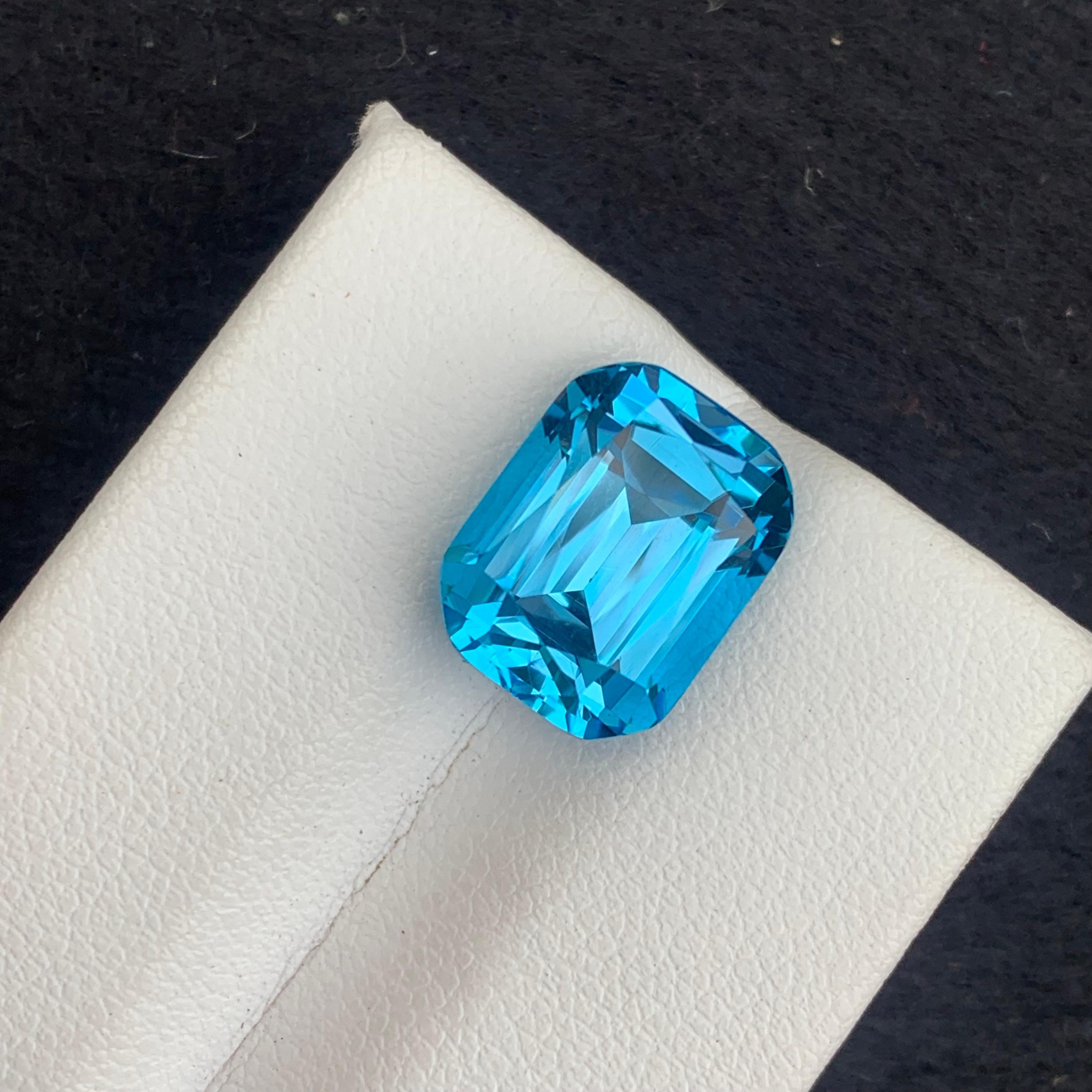 Faceted Electric Blue Topaz
Weight: 10.20 Carats
Dimension: 12.7x9.7x8.6 Mm
Origin: Brazil
Color: Blue
Shape: Long Cushion
Certificate: On Demand