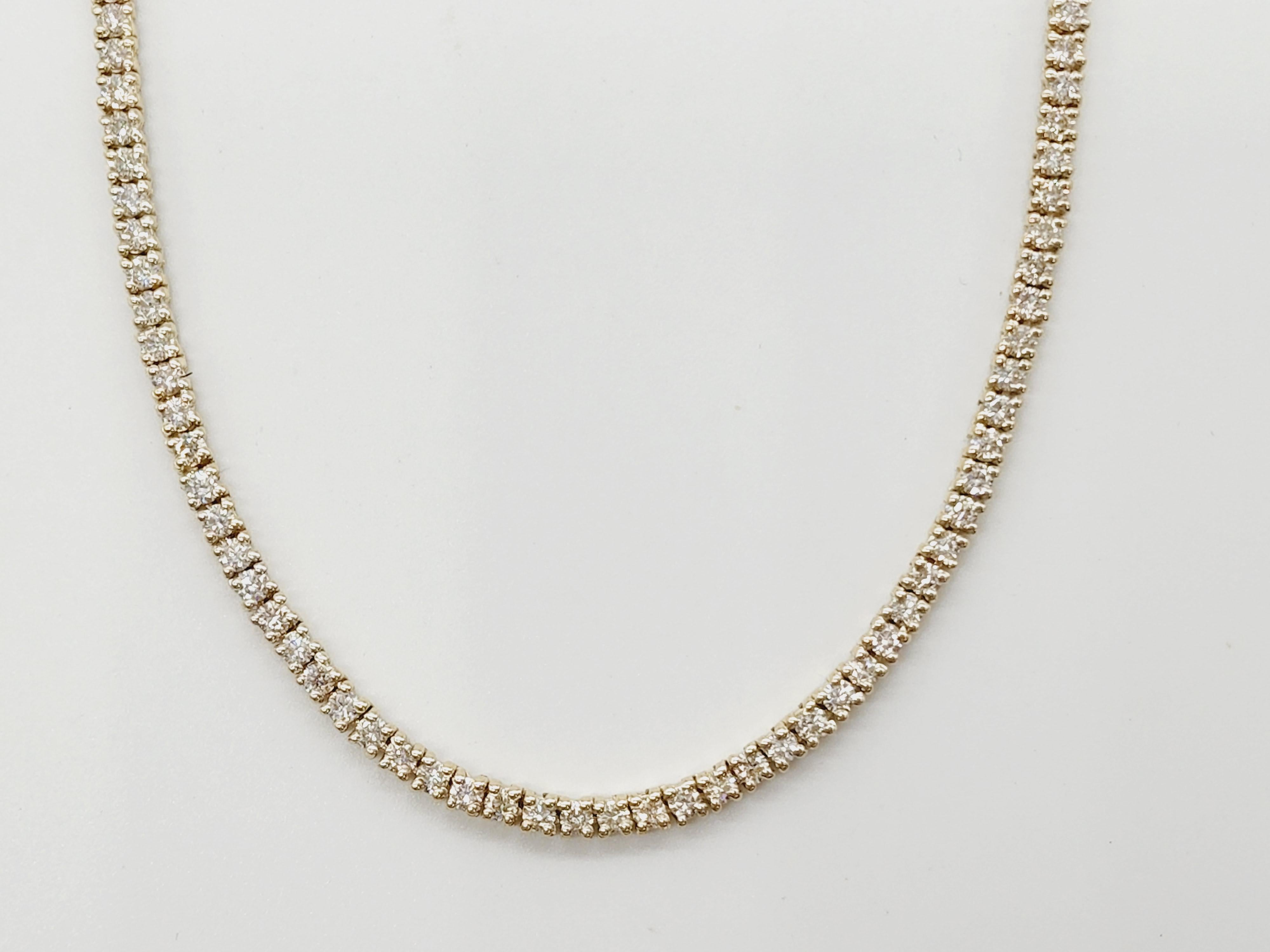 Brilliant and beautiful tennis necklace, natural round-brilliant cut white diamonds clean and Excellent shine. 
14k yellow gold classic four-prong style for maximum light brilliance. 
20 inch length. Average H Color, VS Clarity. 