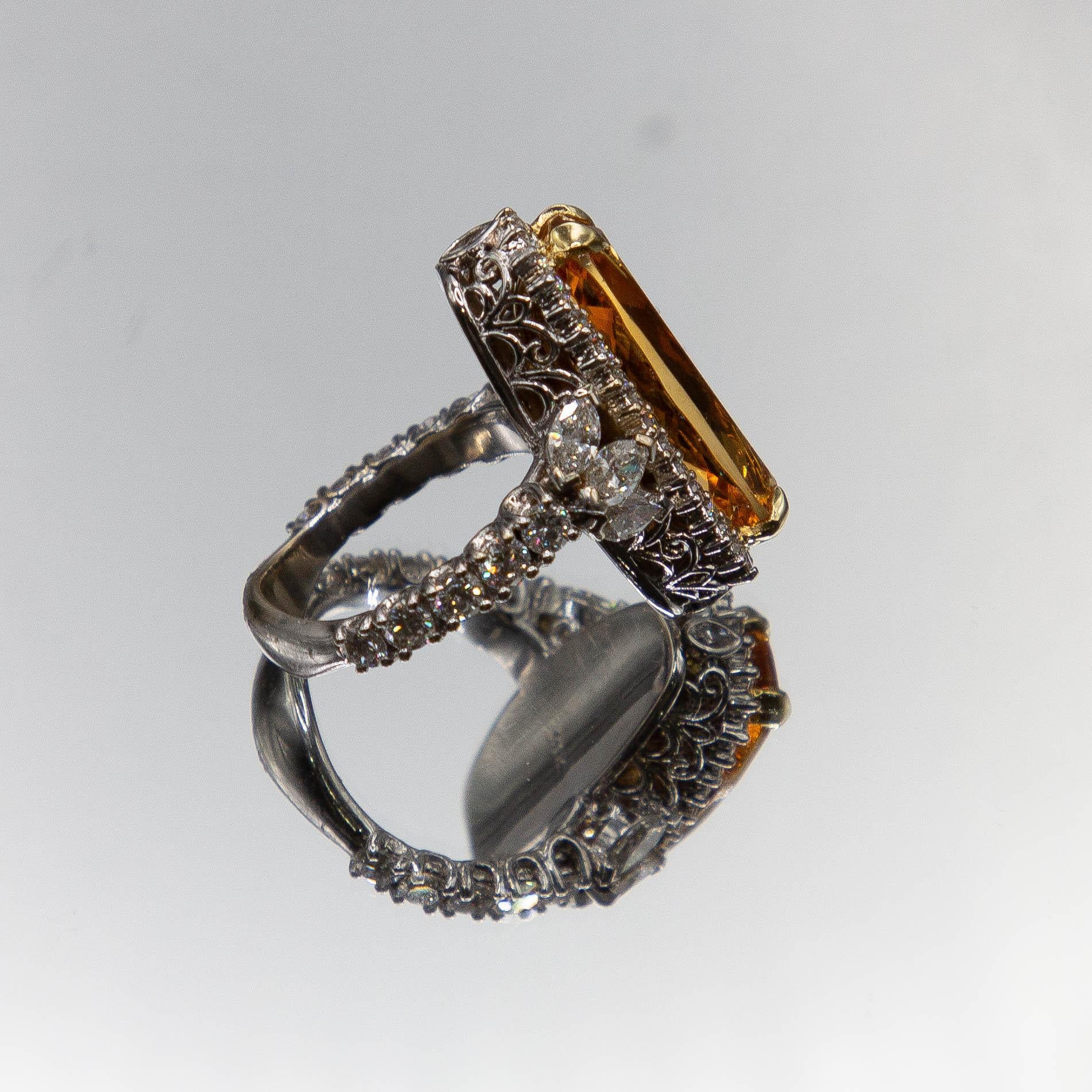 One of a kind 18k white and yellow gold handcrafted ring by renowned designer Anthony Gerard  DiMaggio features, an Idar- Oberstein commissioned, fancy cushion cut 10.02 carat Imperial Topaz. The original gem rough, holding a rare and intense pure