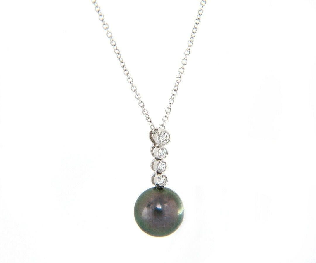 10.20 MM Tahitian Pearl and 0.12ctw Diamond Pendant Necklace in 18K

Tahitian Pearl and Diamond Pendant Necklace
18K White Gold
Pearl Size: Approx. 10.20 MM
Diamonds Carat Weight: Approx. 0.12ctw
Necklace Length: Approx. 16.50 Inches
Weight: Approx.