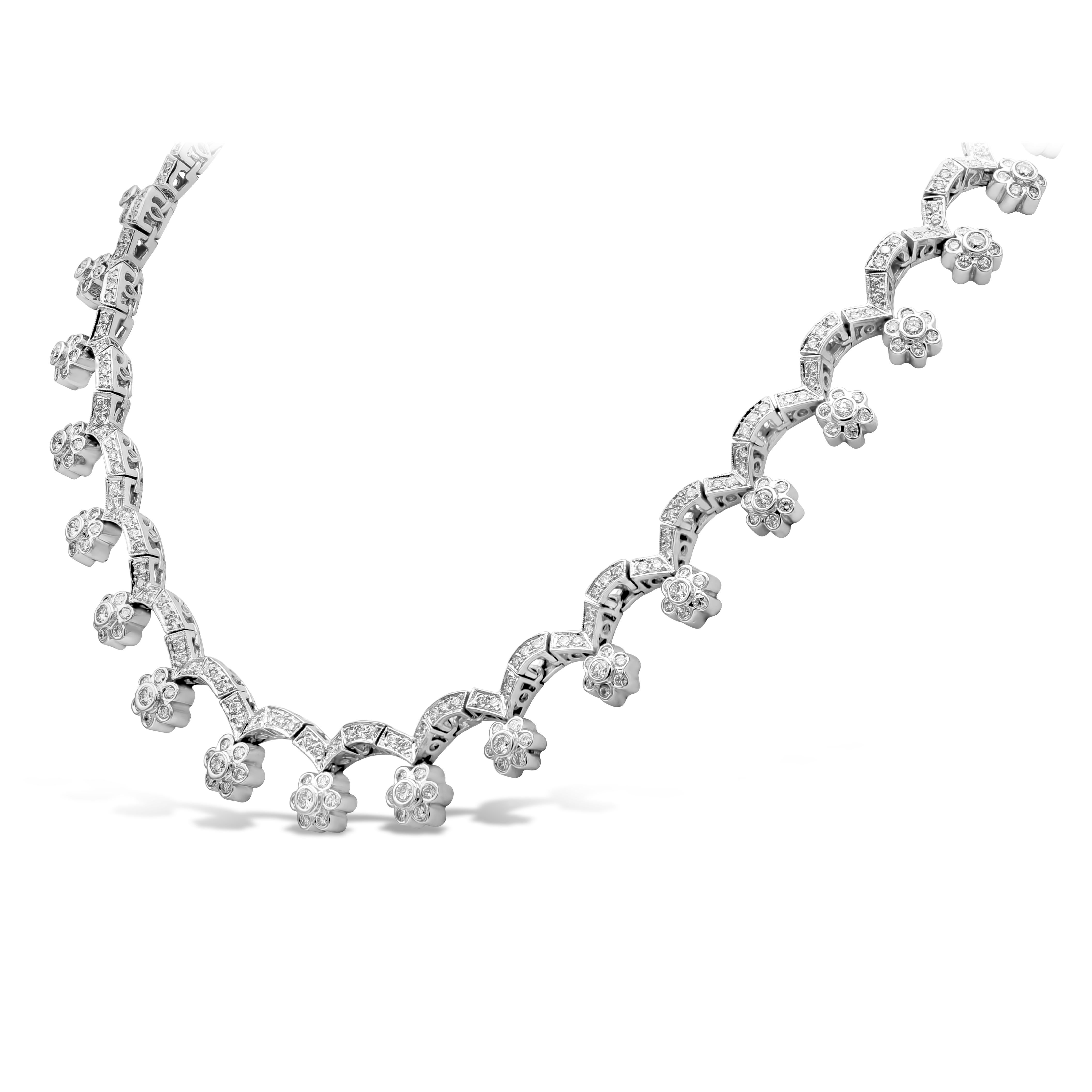A Flower-Motif design necklace showcasing 10.21 carats total round diamonds, G Color and SI in Clarity. Bezel set flower design suspended in an arched design with melee diamonds. Made with 18K White Gold. 

Style available in different price ranges.