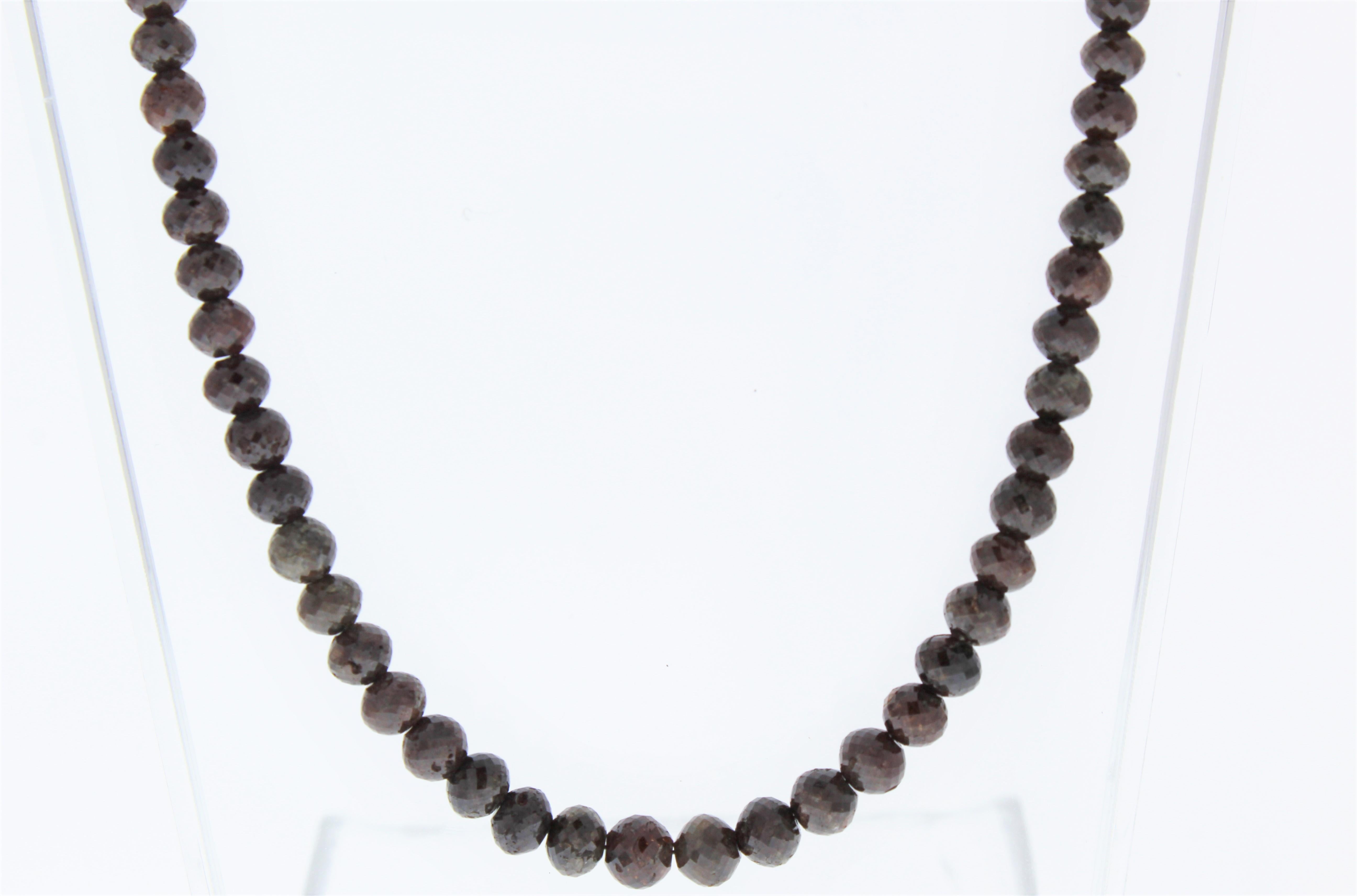This necklace is a dramatic strand of 104 natural brown round diamonds totaling 102.28 carats. Slim in design and perfect for layering alongside other necklaces and chains, this brown diamond necklace is sure to get noticed.
