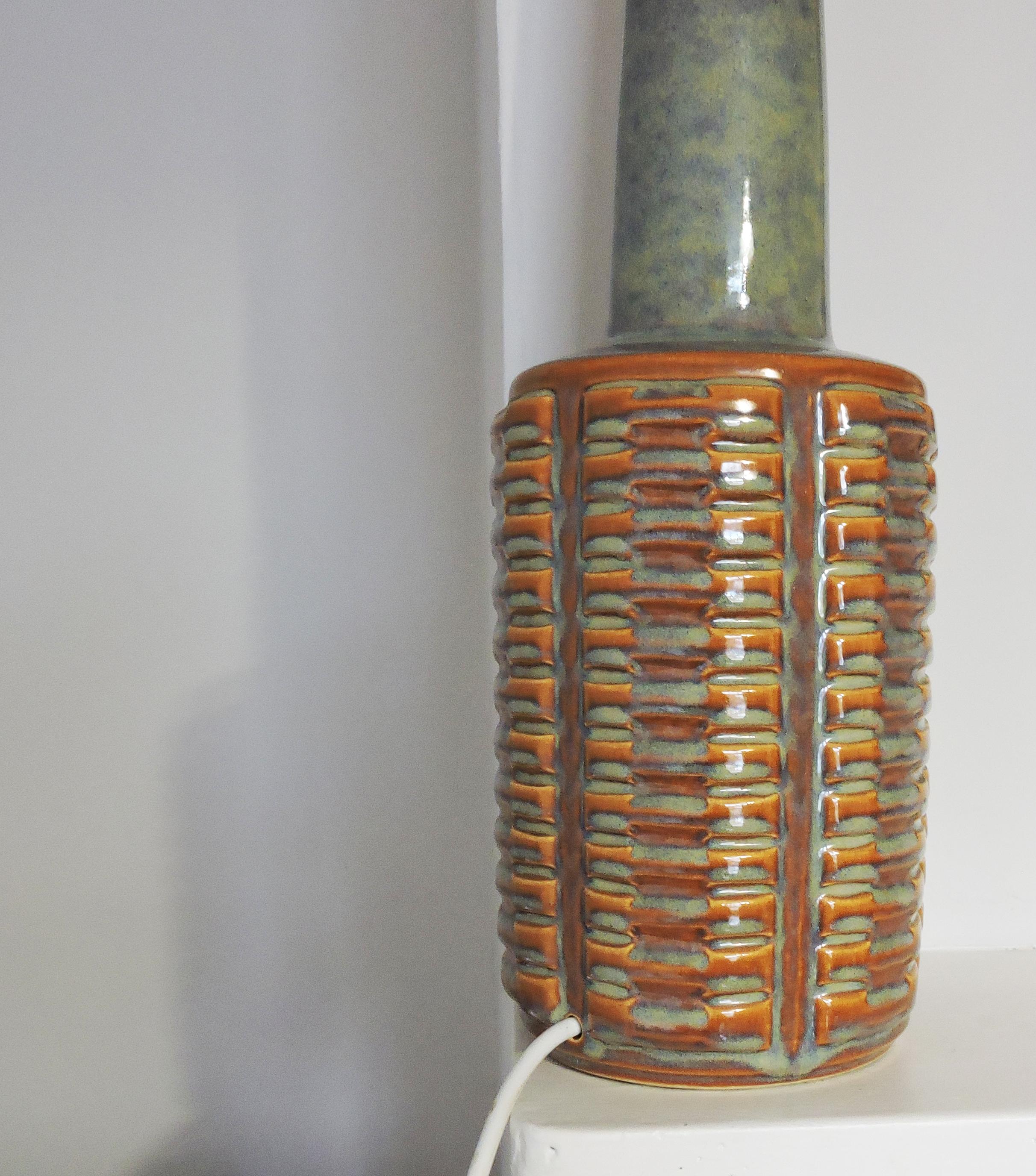 A 1023 table lamp by Einar Johansen for Søholm Stentøj produced in the 1950s.

A professional electrician has rewired this piece to be in working order.

Plug Type - UK Plug (up to 250V).
 