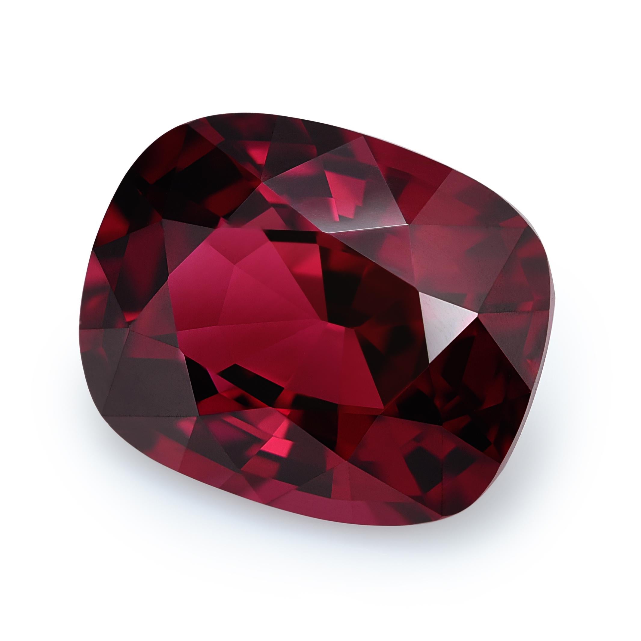 Discover the allure of a natural garnet, 10.24 carats in weight. With a cushion shape measuring 14.1 x 11.5 x 7.5 mm, it captivates with a Brilliant/Step cut, enhancing both brilliance and depth. The rich red color and very eye-clean clarity make it