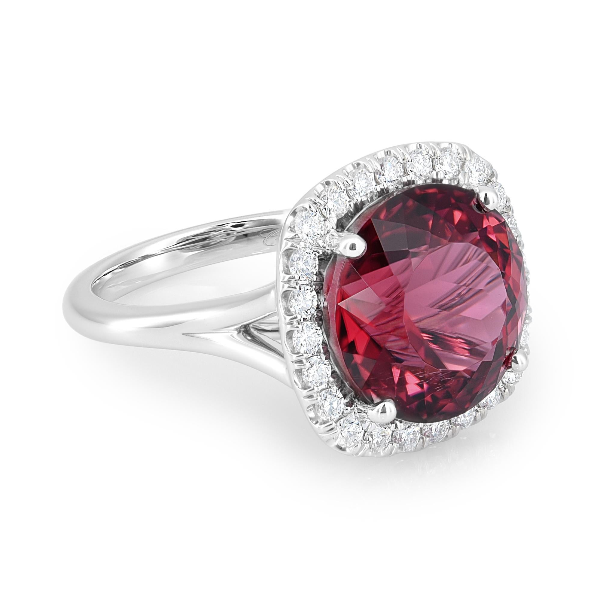Embark on a journey of discovery with a captivating jewelry piece featuring a 10.25 carats Natural Red Tourmaline. Set in 14K white gold, the round-shaped gem, measuring 12.90 x 12.88 x 9.73 mm, takes center stage. The design is further elevated