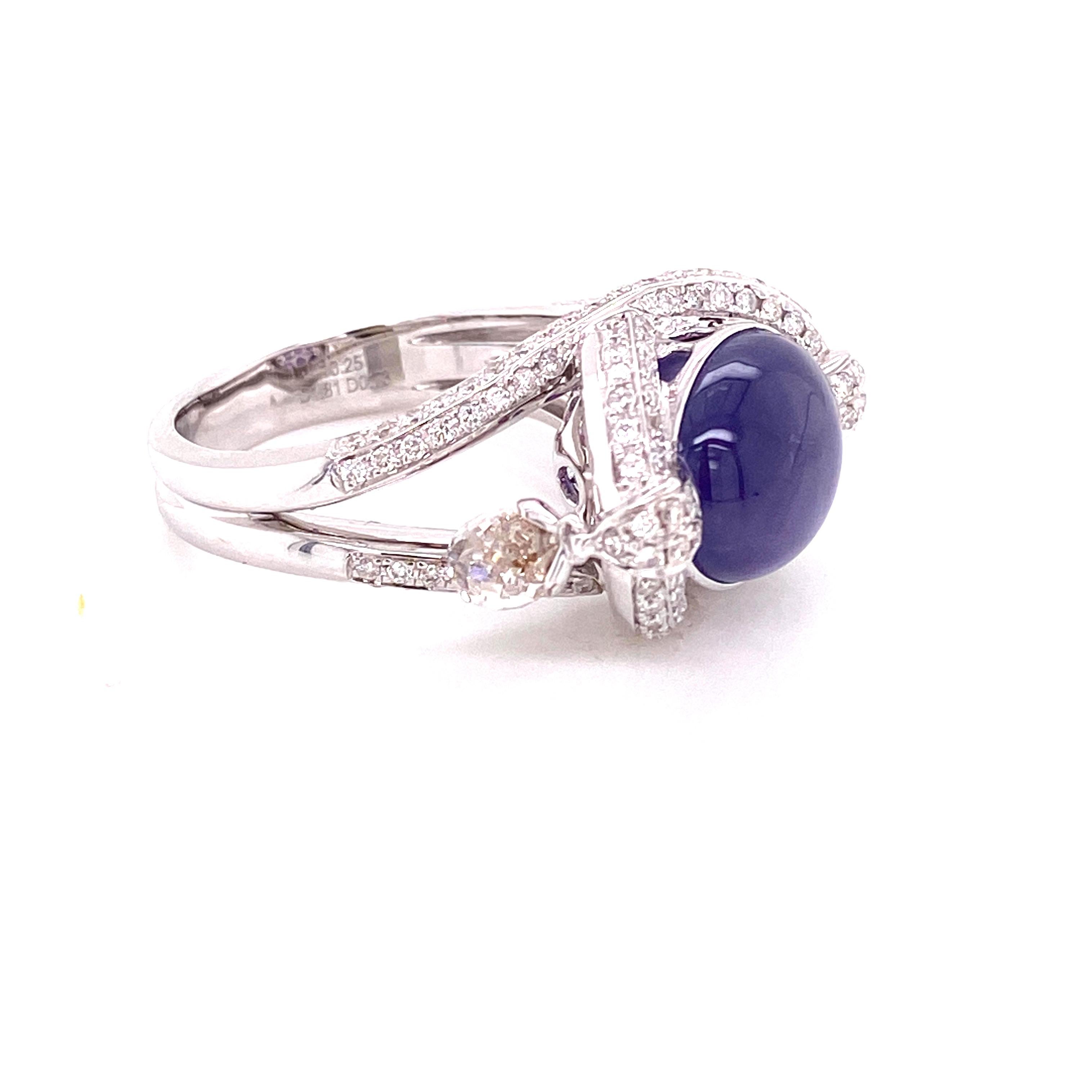 10.25 Carat No Heat Star Sapphire and White Diamond Briolette Engagement Ring:

A unique ring, it features a 10.25 carat unheated lavender star sapphire and a pair of white diamond briolettes weighing 1.81 carat, with multiple white round brilliant