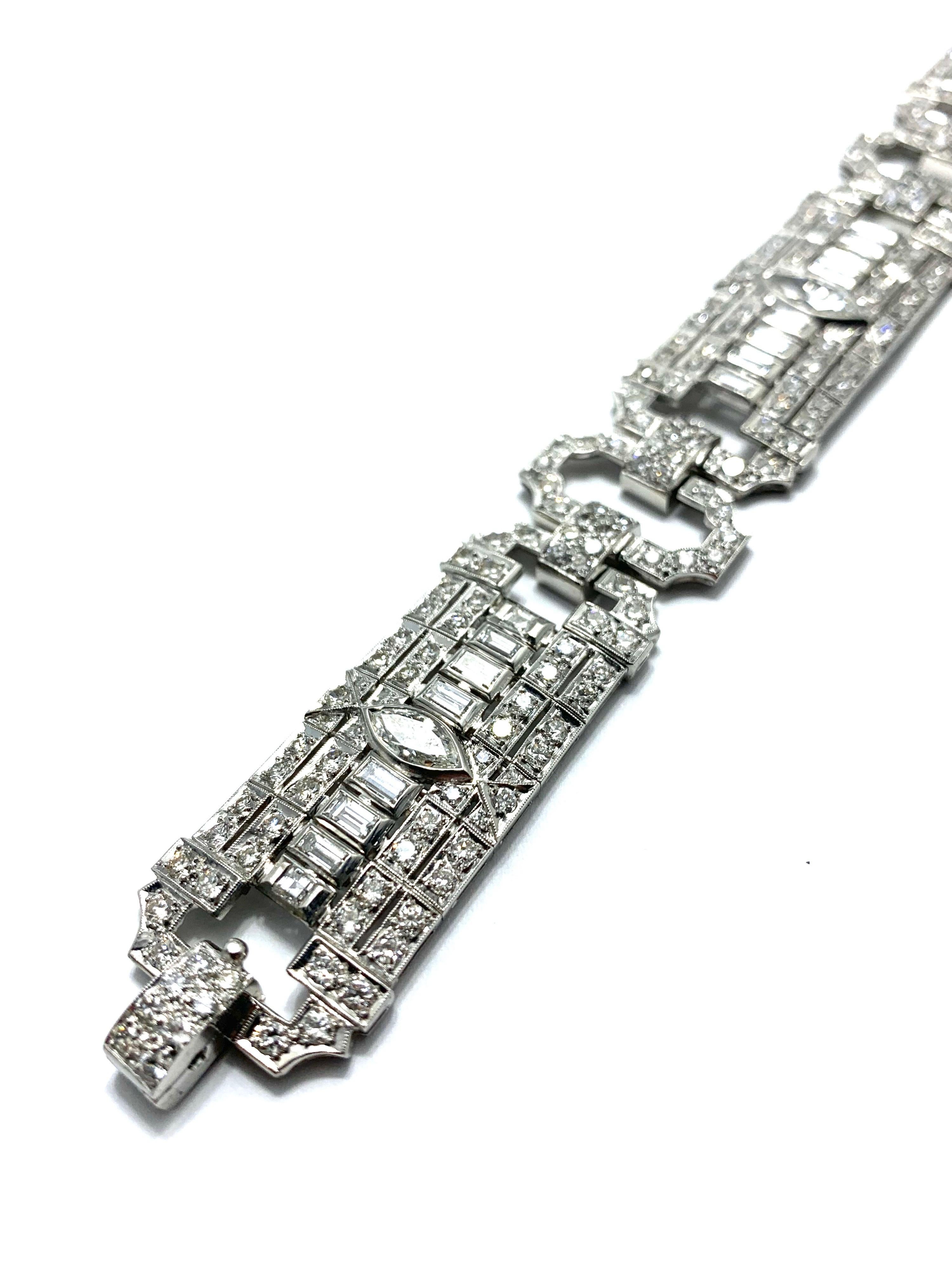 This is a craftsmanship at it's best.  A 10.25 carat Art Deco style period platinum bracelet.  The bracelet consists of round, baguette, and marquise Diamonds.  The Diamonds are graded as G color, VS clarity.  The center Marquise diamond is 1.01