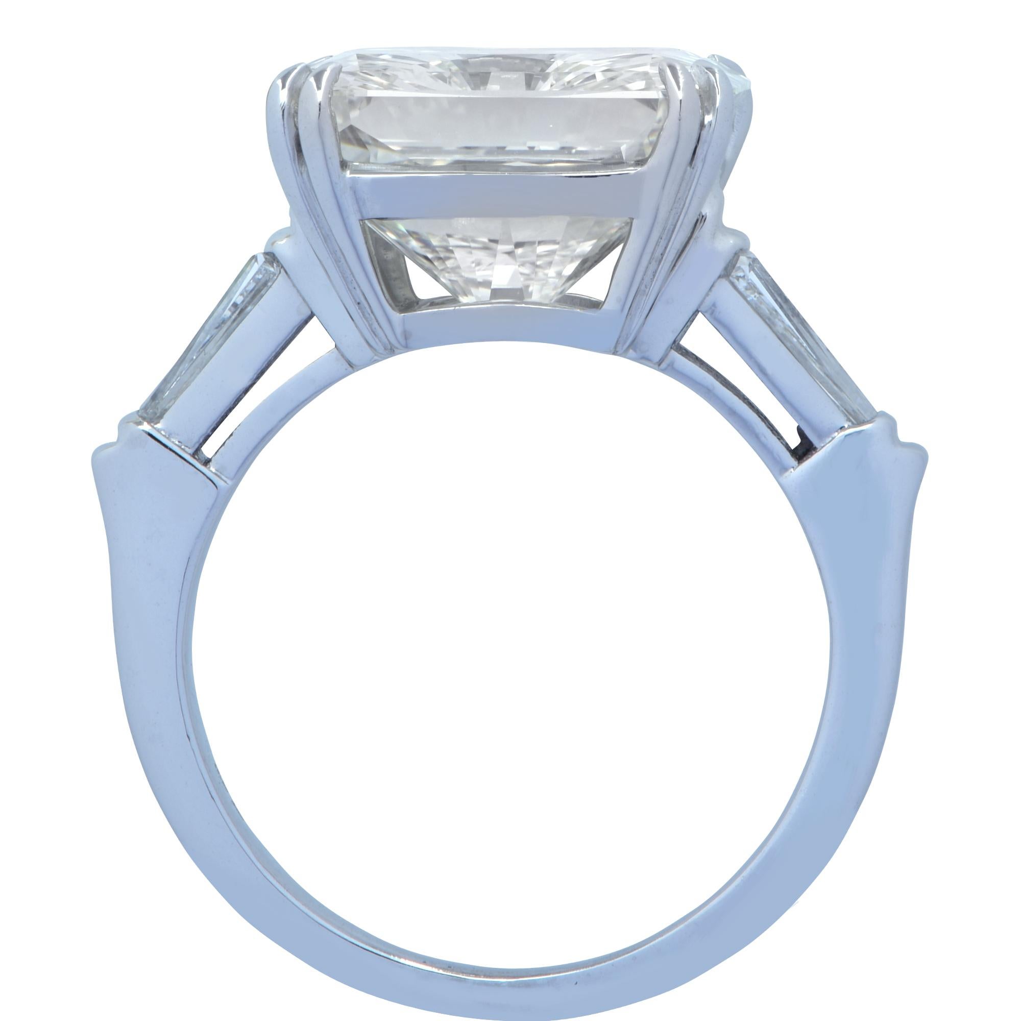 Breathtaking engagement ring crafted in platinum, showcasing a dazzling radiant cut diamond weighing an impressive 10.26 carats, L color and VS2 clarity, GIA Certified with very good polish and symmetry. The spectacular center stone is accented by 4