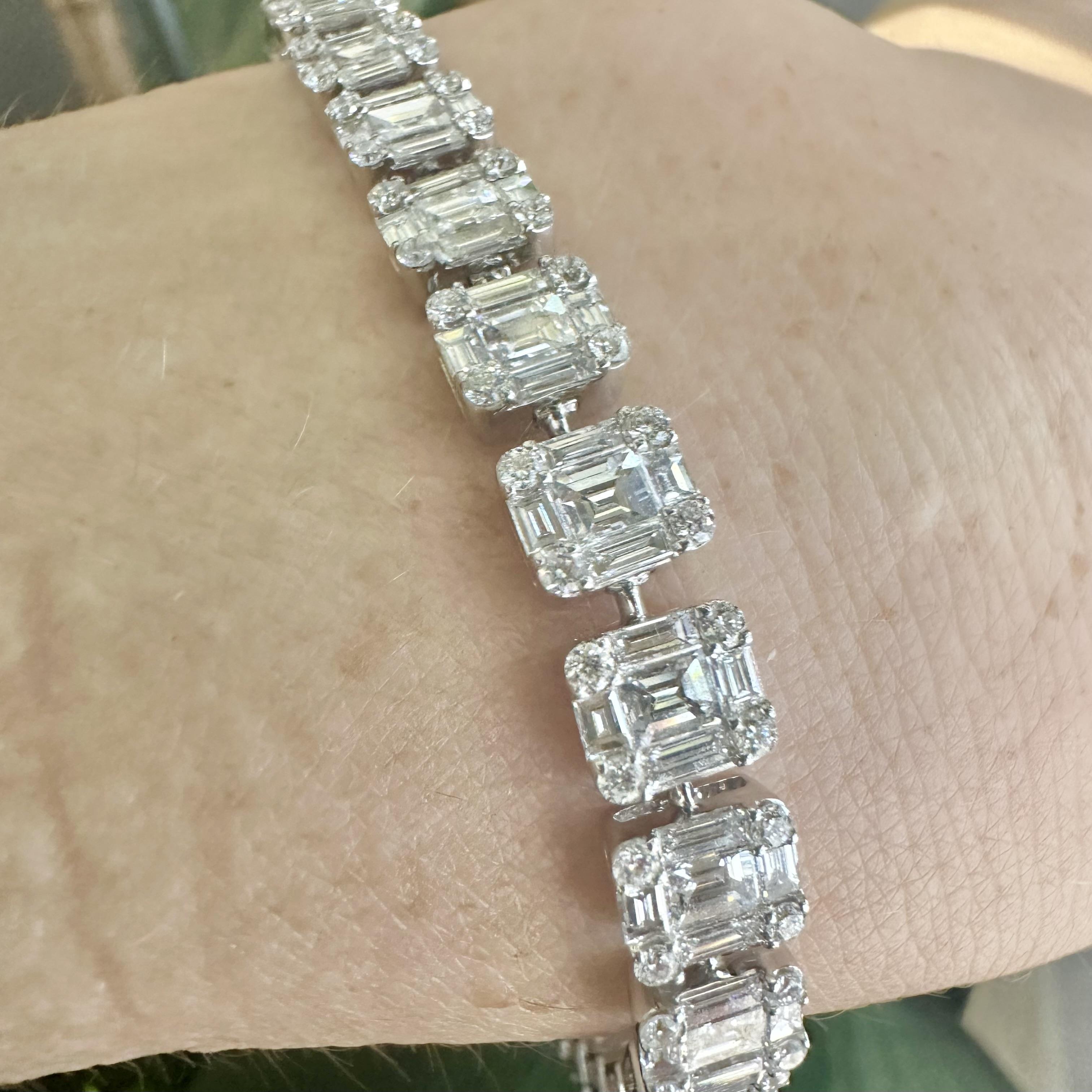 Style: Optical Illusion Tennis Link Bracelet
Metal: White Gold
Metal Purity: 18k
Stones: Baguette, Round, and Asscher Cut Diamonds
Diamond Color: G-H
Diamond Clarity: VS
Total Carat Weight: approx 10.26 ct
Total Item Weight (g): 18
Bracelet Length:
