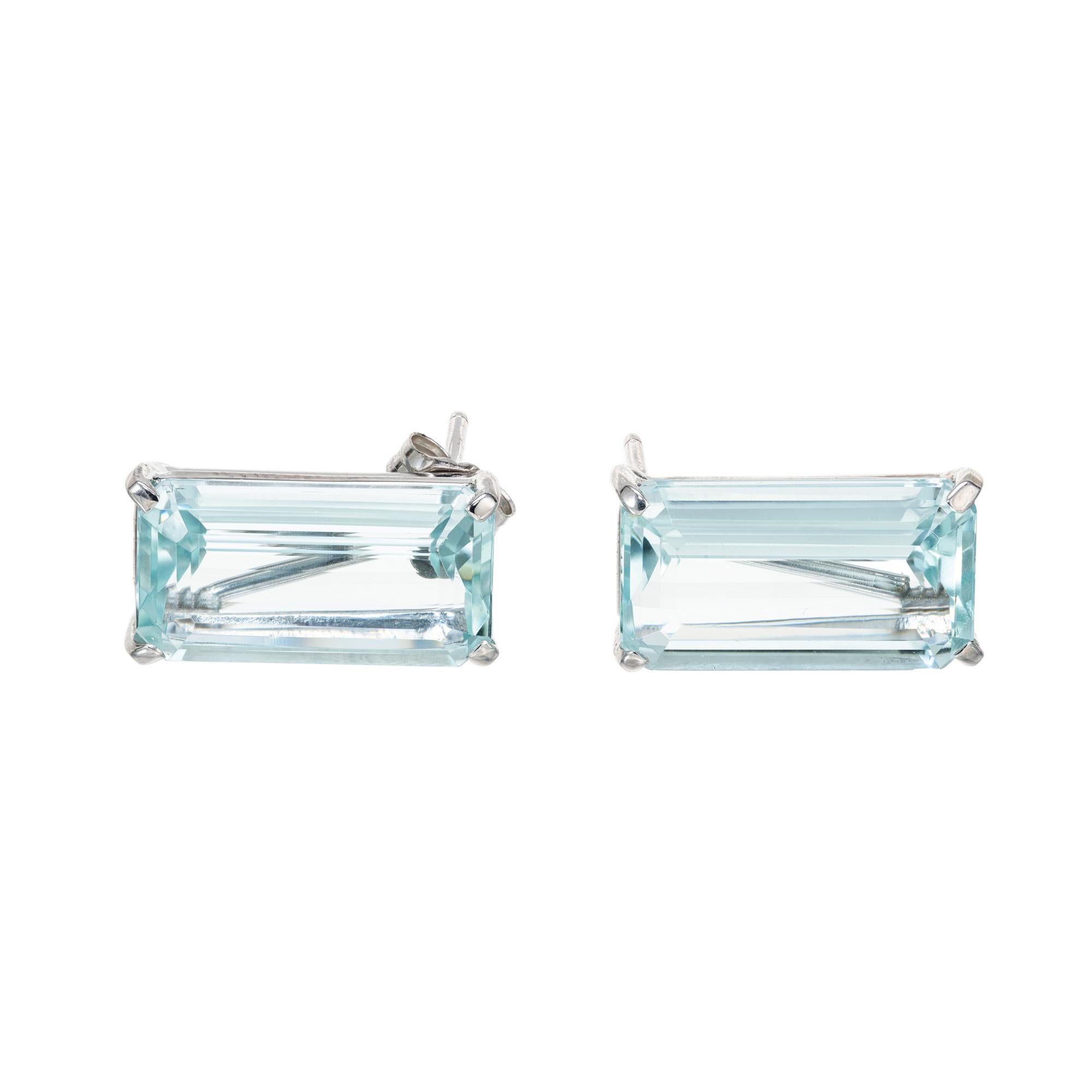 Mid-Century bright, clear untreated aqua earrings. Two Emerald cut elongated rectangle aquamarine's totaling 10.27 carat set in four prong, 14k white gold classic settings. These gemstones have a rich blue, bright color and com from a 1950's estate.