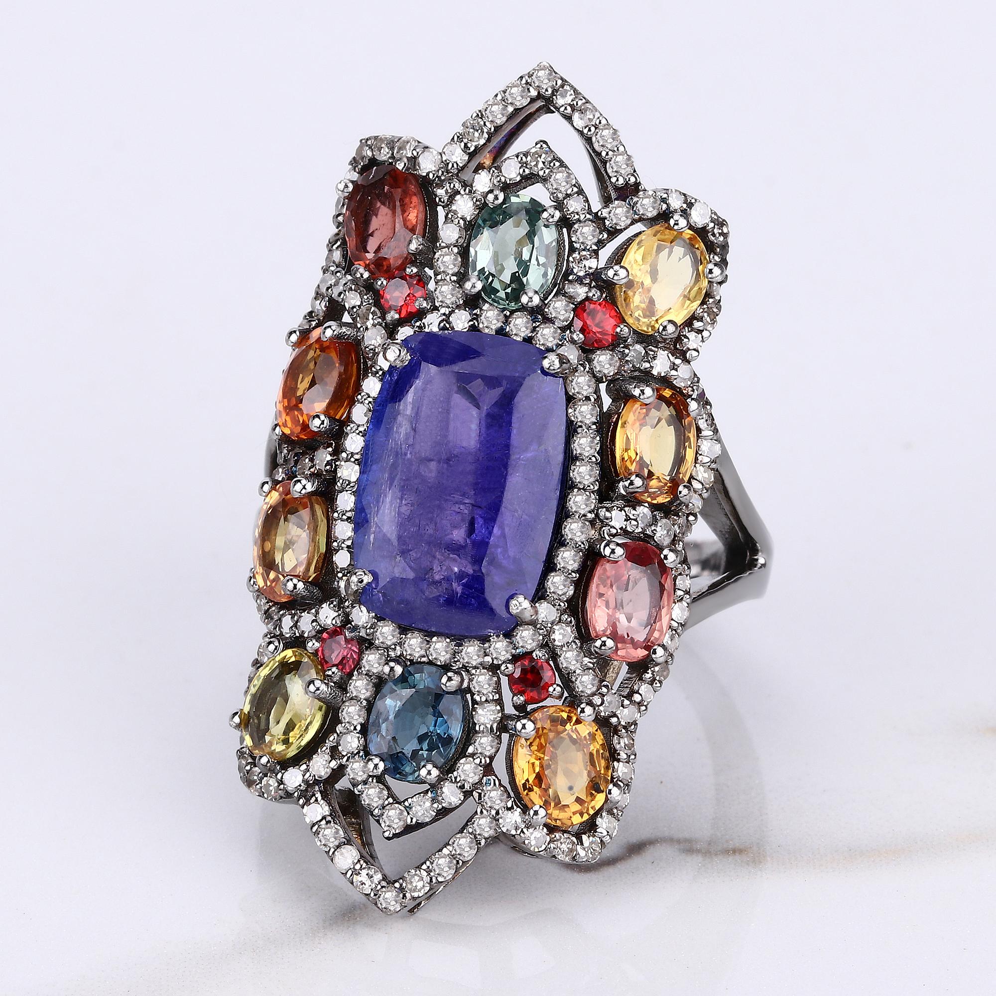 10.27cttw Tanzanite, Multi-Sapphires with Diamonds 1.18cttw Sterling Silver Ring

Vivid colors give this ring a powerful and dramatic presence. A richly-hued opaque tanzanite cushion-cut and multi-sapphires totaling 10.27 carats is haloed by 1.18