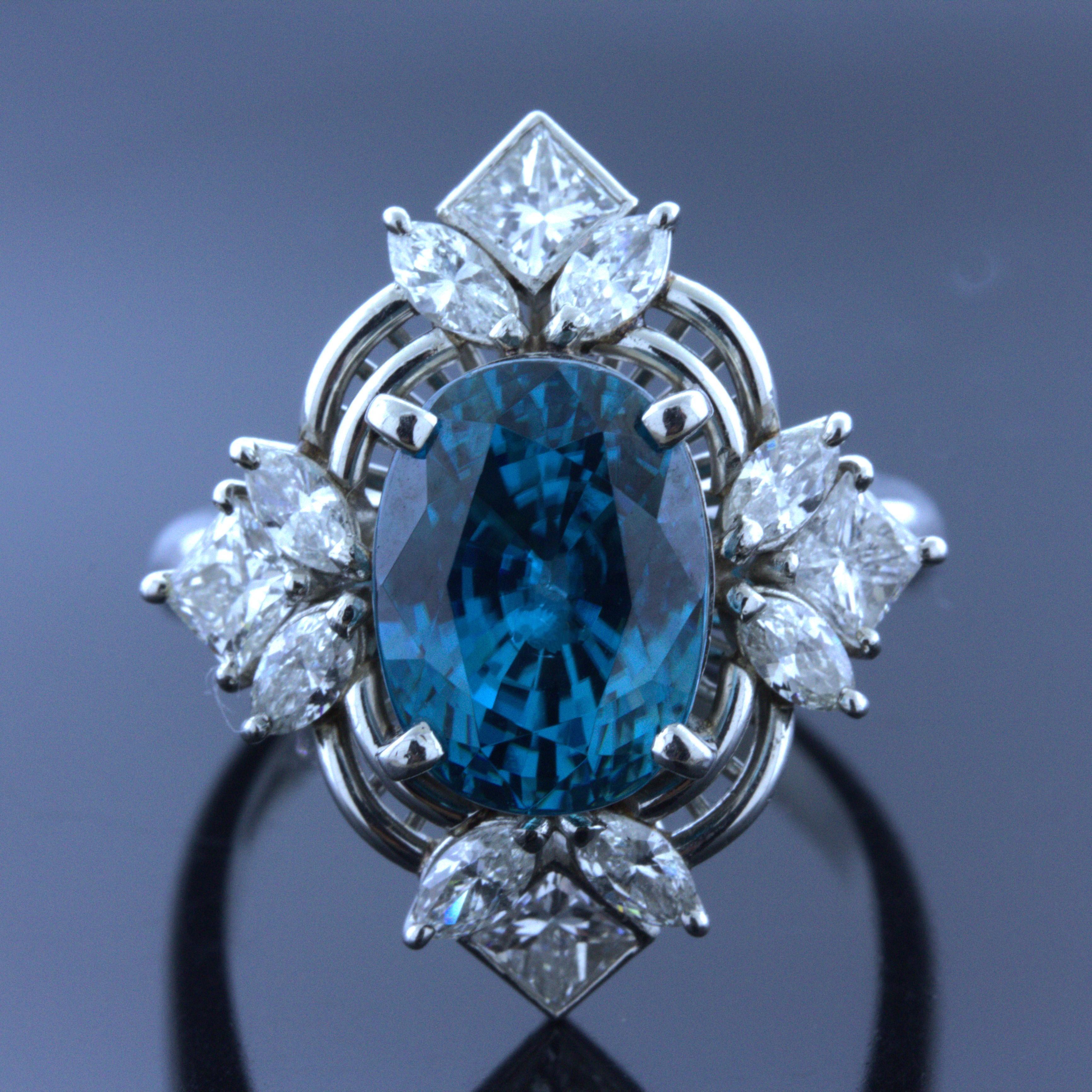 A lovely platinum ring featuring a large and vibrant blue zircon. It weighs an impressive 10.28 carats while having an intense blue color along with excellent brilliance and fire, (more than diamond) giving it a scintillating look. It is