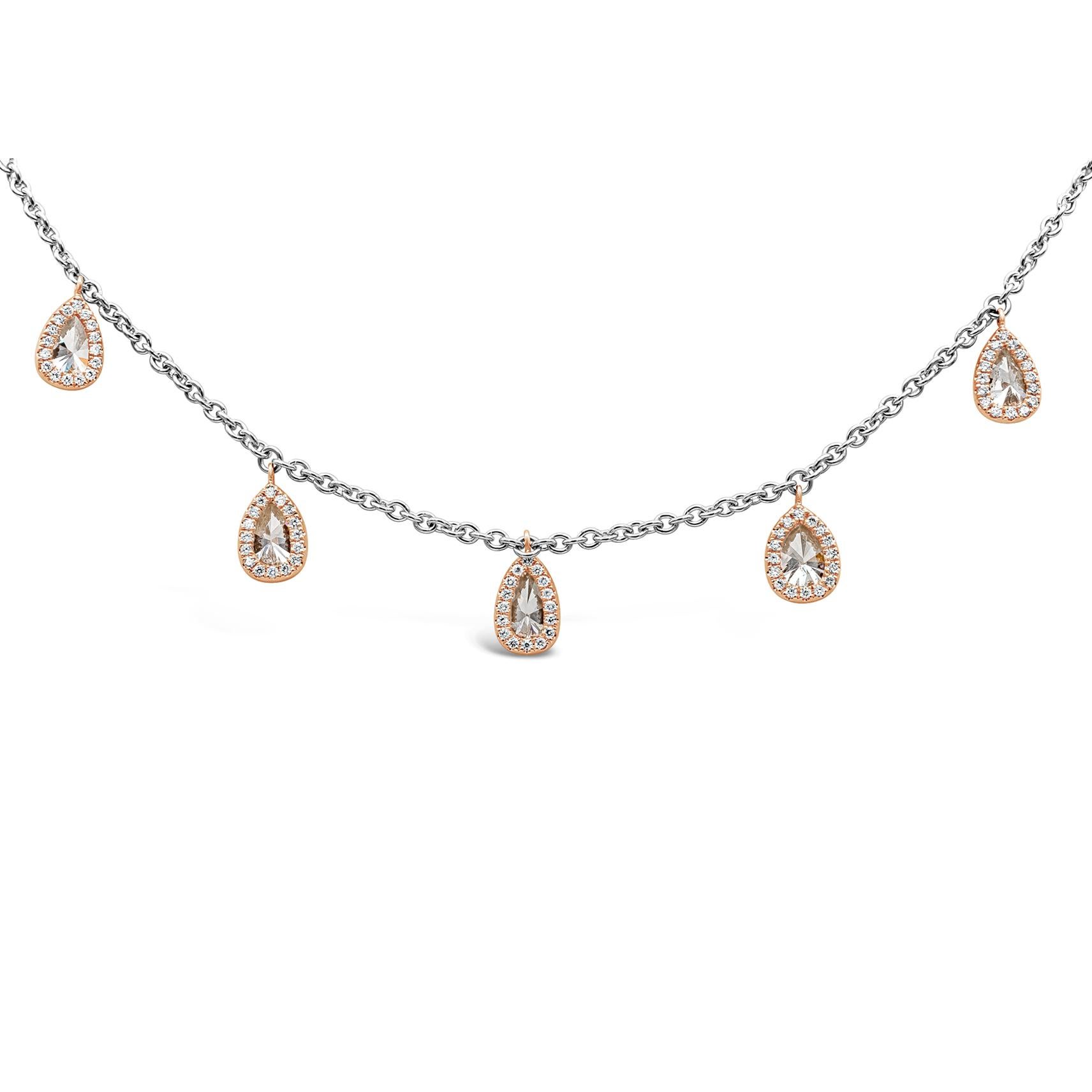 A unique style double-sided necklace featuring pear shape diamonds spaced evenly on a 19 inch platinum chain. Reversing the necklace showcases a brilliant diamond halo along the bezel of the diamond and constitutes another style of the necklace.