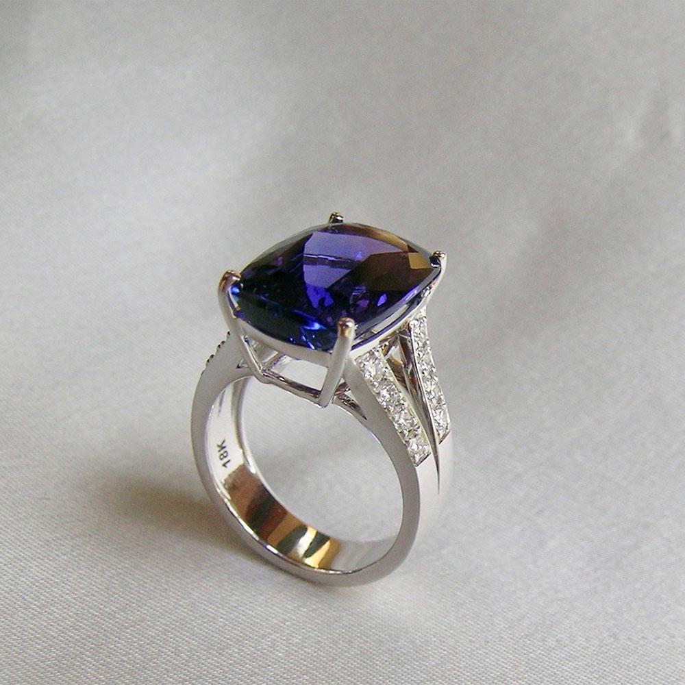 An amazing and perfectly clean 10+ carat Tanzanite is set in 18k White Gold and enhanced with 0.58cts of Diamonds on the band.  This ring design is meant to showcase the gemstone.  It is a One of a kind beauty, fabulous for any occasion.  Sensitive