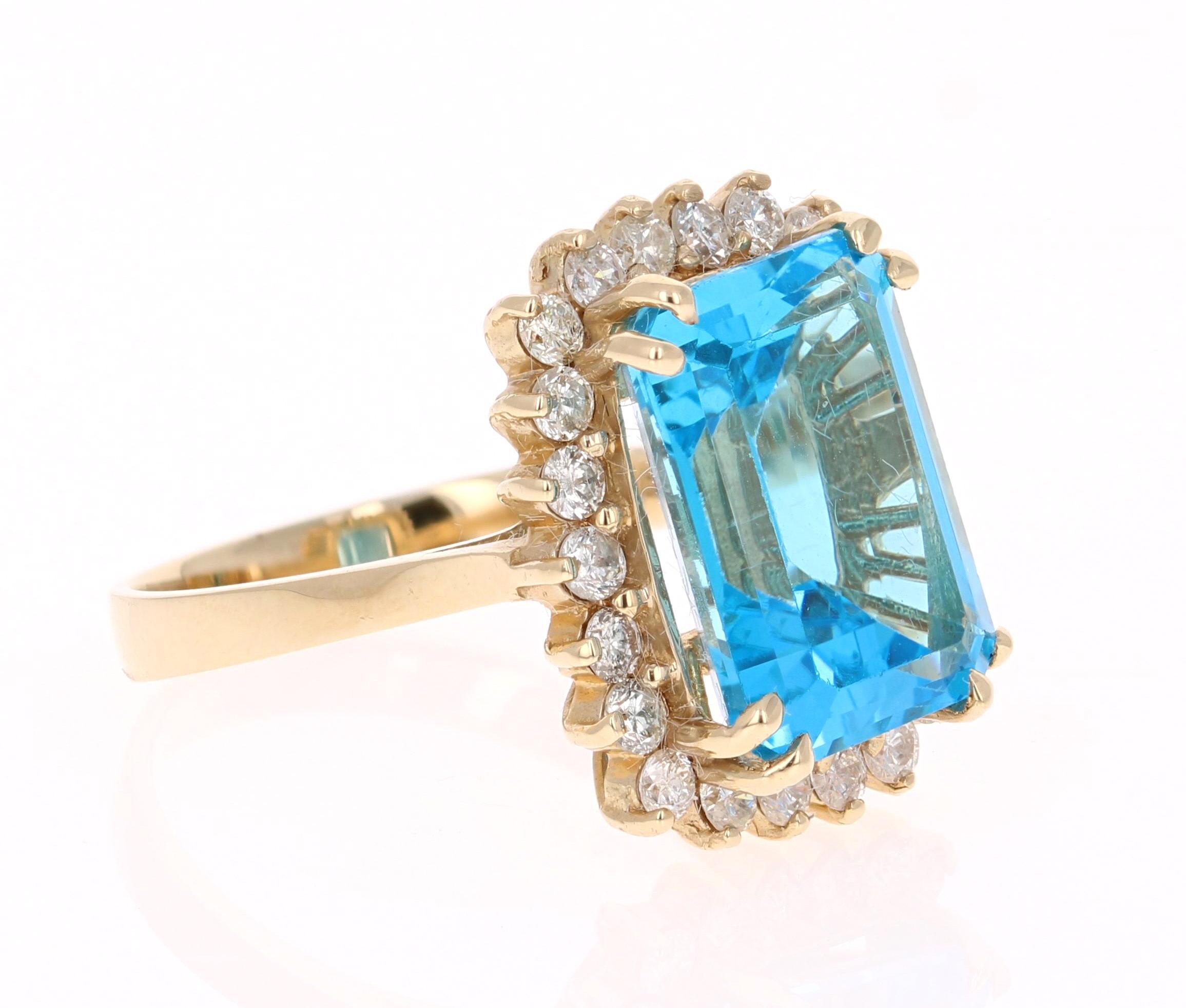 This beautiful Emerald cut Blue Topaz and Diamond ring has a stunning 9.39 carat Blue Topaz and its surrounded by 22 Round Cut Diamonds that weigh 0.89 carats. The total carat weight of the ring is 10.28 carats. 
The setting is crafted in 14K Yellow