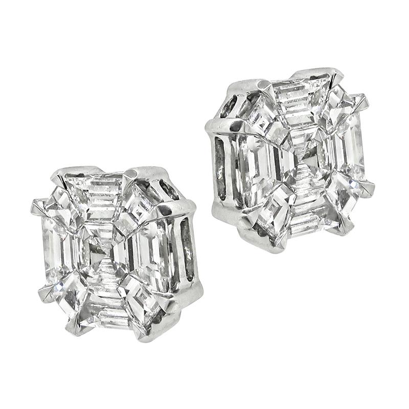 This is an elegant pair of 14k white gold diamond illusion set stud earrings. The earrings feature sparkling baguette, asscher and trapezoid cut diamonds that weigh approximately 1.02ct. The color of these diamonds is F with VS clarity. The earrings