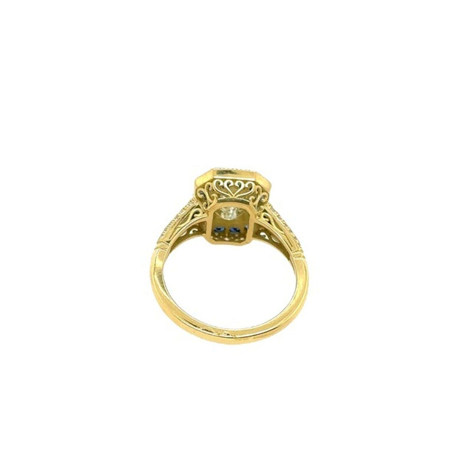 Women's 1.02ct J/VVS2 Emerald Cut Diamond with Sapphire Halo Ring in 18ct Yellow Gold For Sale