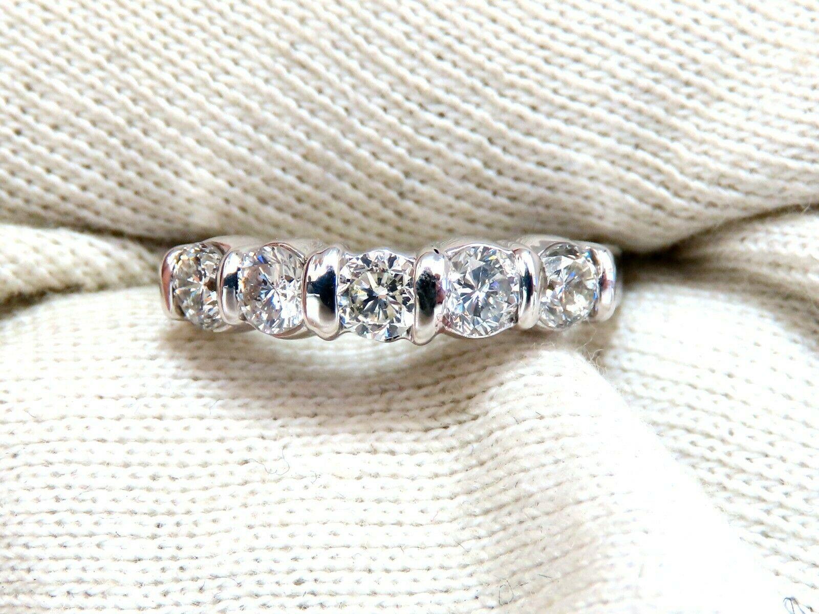 Super Durable Channel Band

1.02ct Natural Diamonds

 Full cut, Rounds 

I color, Si-2 clarity

Platinum
4.6 Grams

4.2mm wide 

3.5mm depth

current size: 5.75

We may resize (please inquire).

$3000 appraisal certificate will accompany