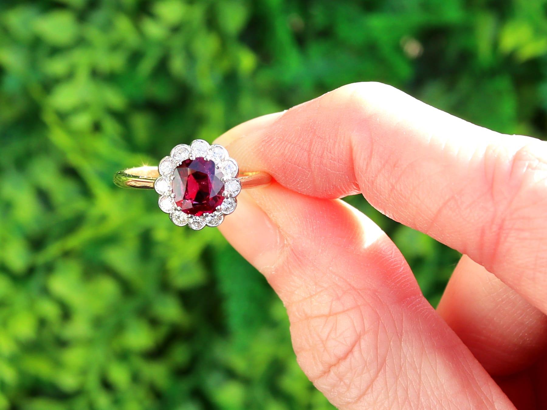 A stunning, fine and impressive antique 1.02ct ruby and 0.33 carat diamond, 18 karat yellow gold and platinum set dress ring; part of our diverse collection of ruby cluster rings.

This stunning, fine and impressive ruby ring has been crafted in 18k