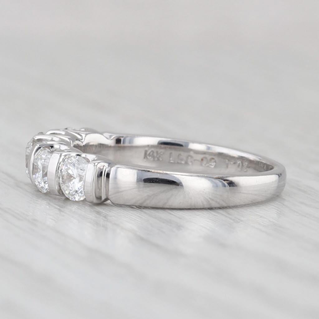 Gemstone Information:
- Natural Diamonds -
Total Carats - 1.02ctw
Cut - Round Brilliant
Color - D - E
Clarity - SI1 - SI2
Engraved - LEO 226881
GSI Report - 3220300112

Metal: 14k White Gold
Weight: 4.4 Grams
Stamps: 14k 1.02 The LEO
Face Height: 4