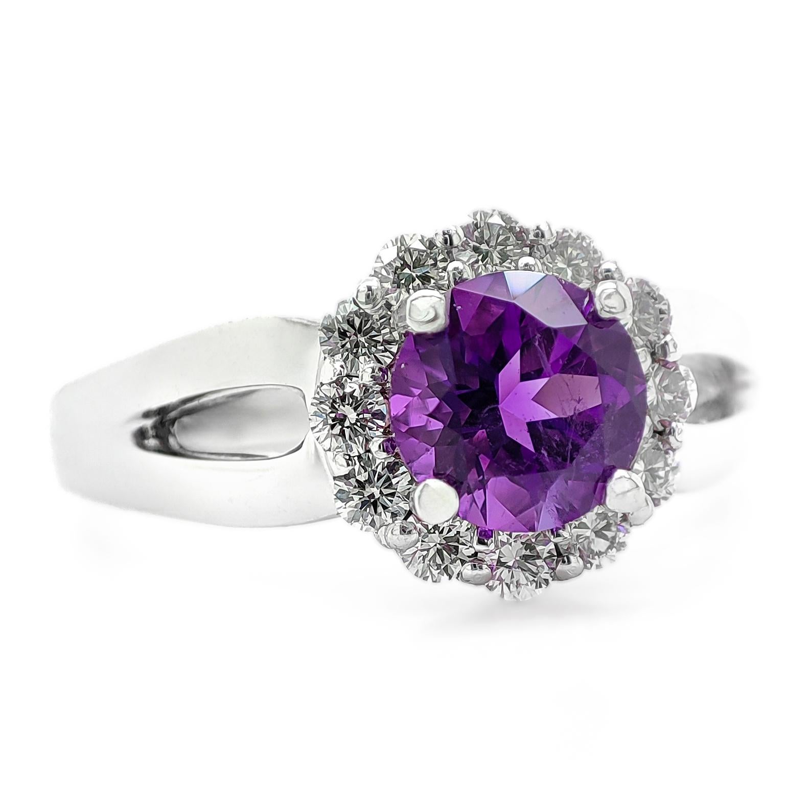FOR US BUYER NO VAT

This beautiful piece features a 0.72 carat purple quartz as its centerpiece, adding a captivating burst of color to its design.

Enhancing the allure of the quartz are 12 diamonds, totaling 0.30 carats. These diamonds exhibit a