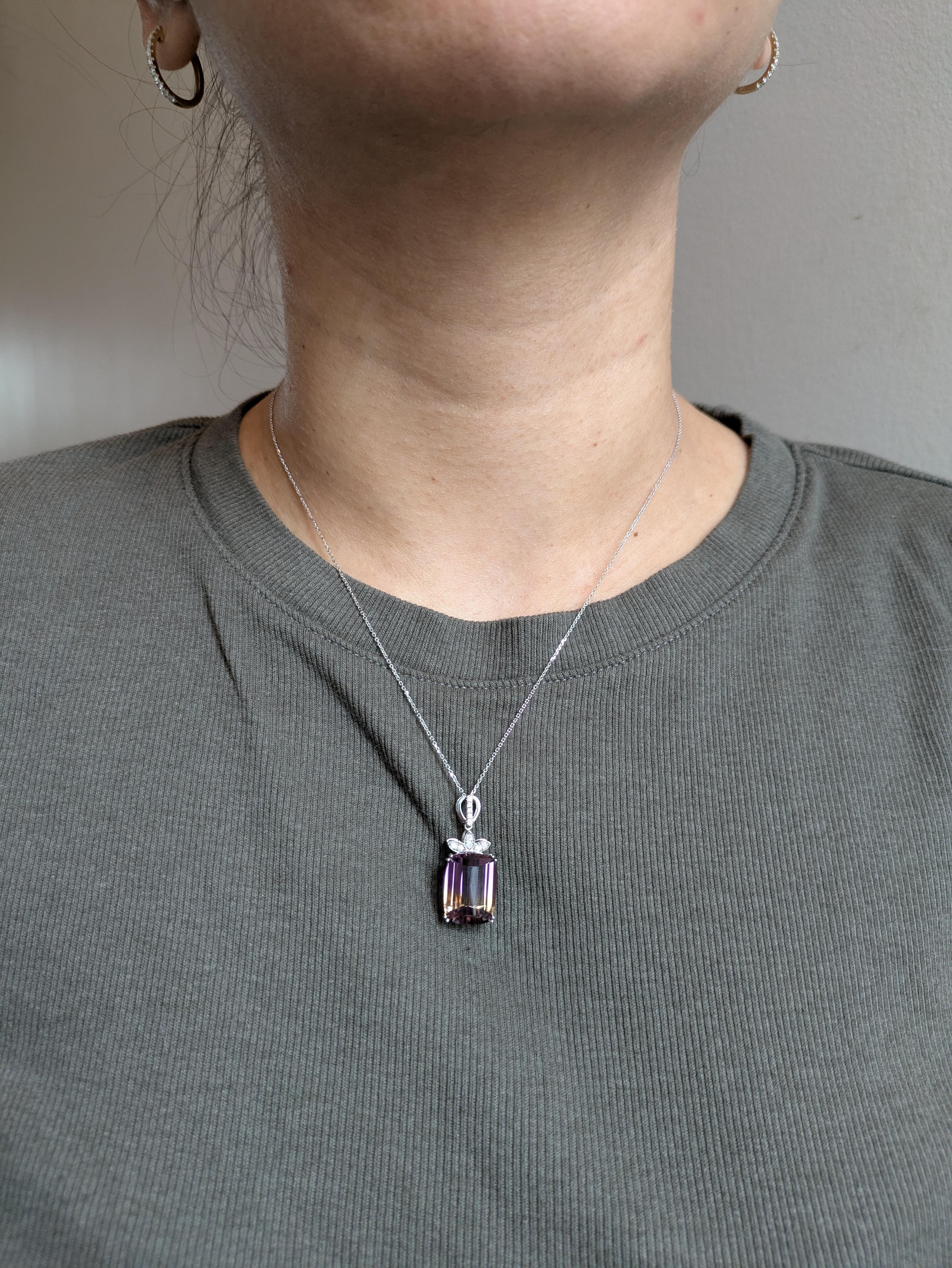 A mesmerizing 10.33ct ametrine takes center stage in this unique pendant, accented by real earth-mined diamonds and crafted in solid 14k gold. With its natural blend of amethyst and citrine tones, it’s a luxurious piece with vibrant