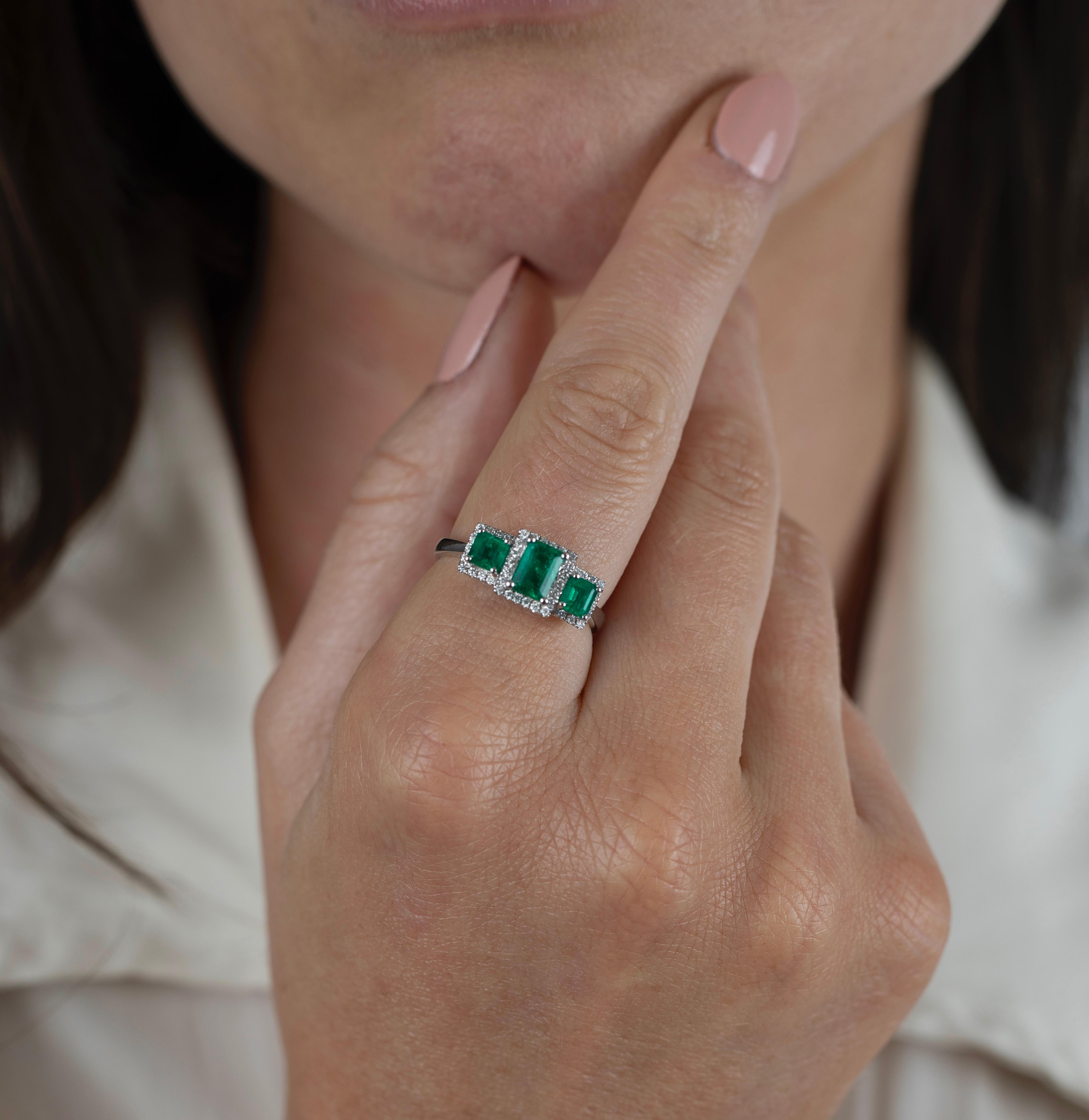Three-Stone 1.03 Carats Emerald-Cut Vivid Green Natural Colombian Emeralds accented by 0.19 Carats of Round-Brilliant Cut Diamonds and set in a delicate 18K White Gold setting.

Details:
✔ Stone: Emerald
✔ Emerald Weight: 1.03 carat (total weight)
✔