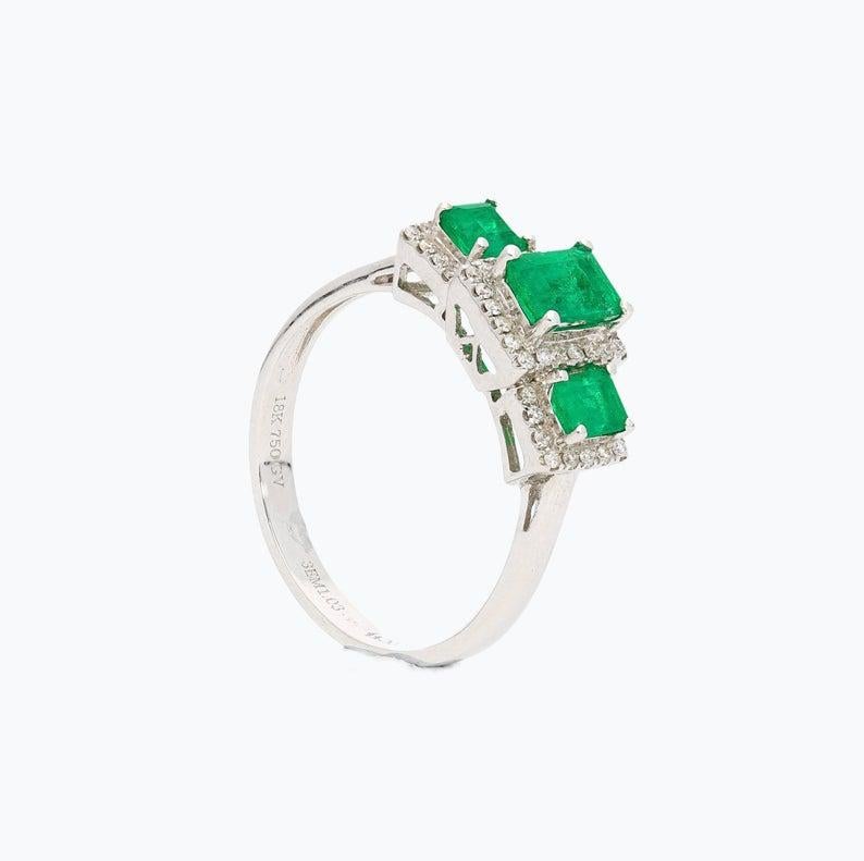 Women's 1.03 Carat Colombian Emerald, Diamond, and 18 Karat White Gold Three-Stone Ring For Sale