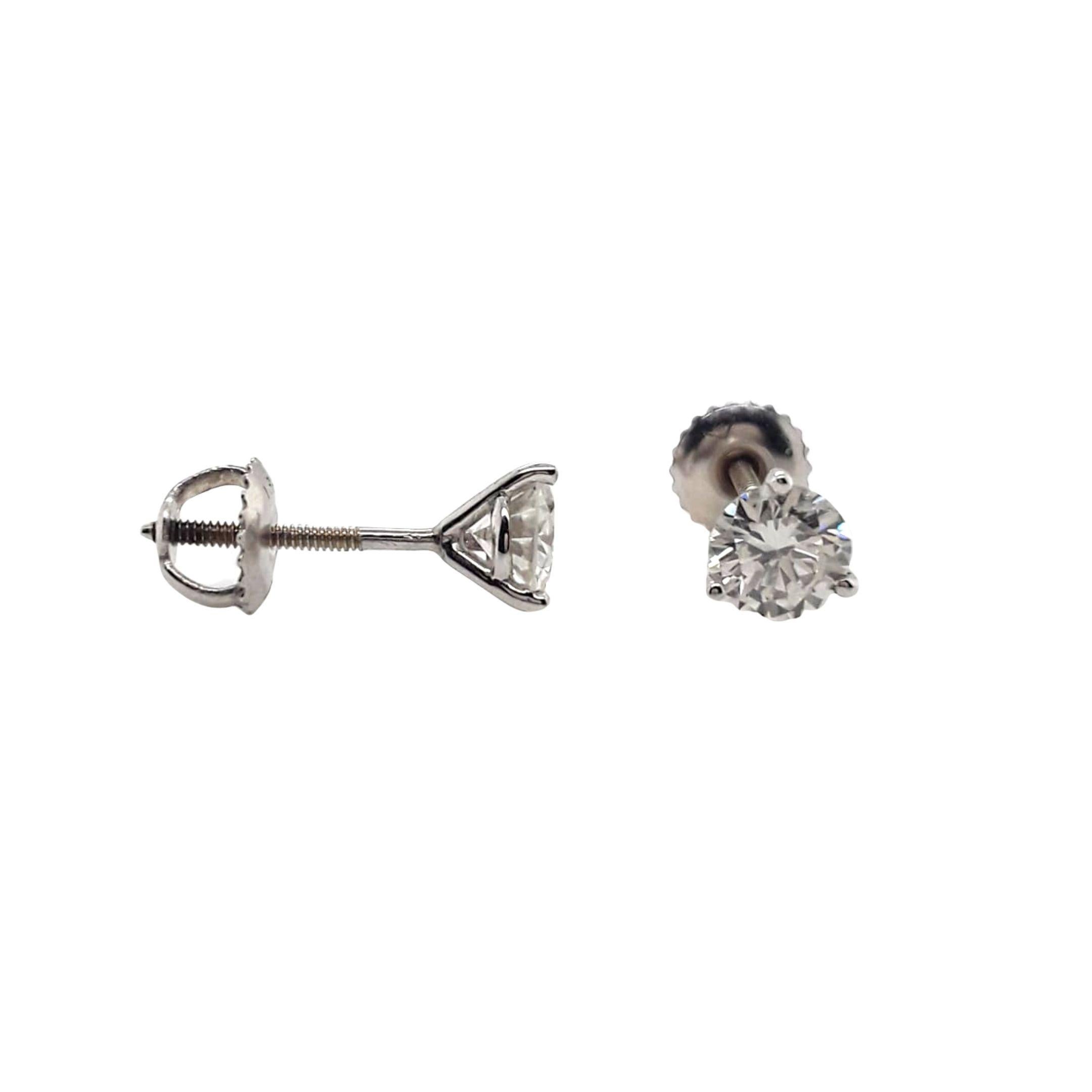 Diamond Stud Earrings made with natural brilliant cut diamonds. Total Weight: 1.03 carats, Stone Diameter: 5.22 x 5.30. Set on a 3 prong mounting in 18 karat white gold, screw back setting. 