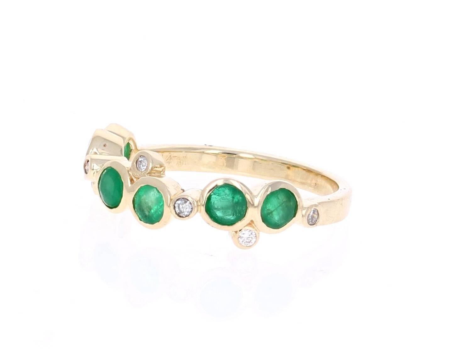 Cute and dainty Emerald and Diamond band that is sure to be a great addition to anyone's accessory collection.   There are 6 Round Cut Emeralds that weigh 0.93 carats and 7 Round Cut Diamonds that weigh 0.10 carats.  The total carat weight of the