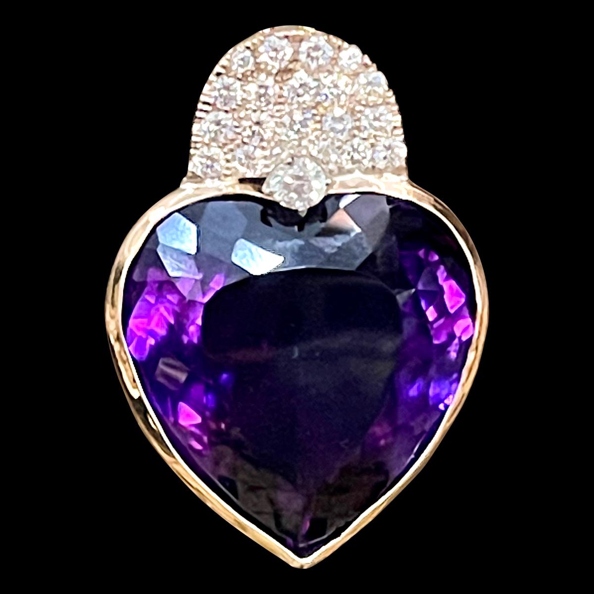   Approximately 103 Carat Heart Shape Amethyst & 3 Ct Diamond Pendant Necklace 14 Kt Yellow Gold
This spectacular Pendant Necklace  consisting of a single large Perfect heart shape l Amethyst , approximately 103-105  Carat.  The  Amethyst   Has