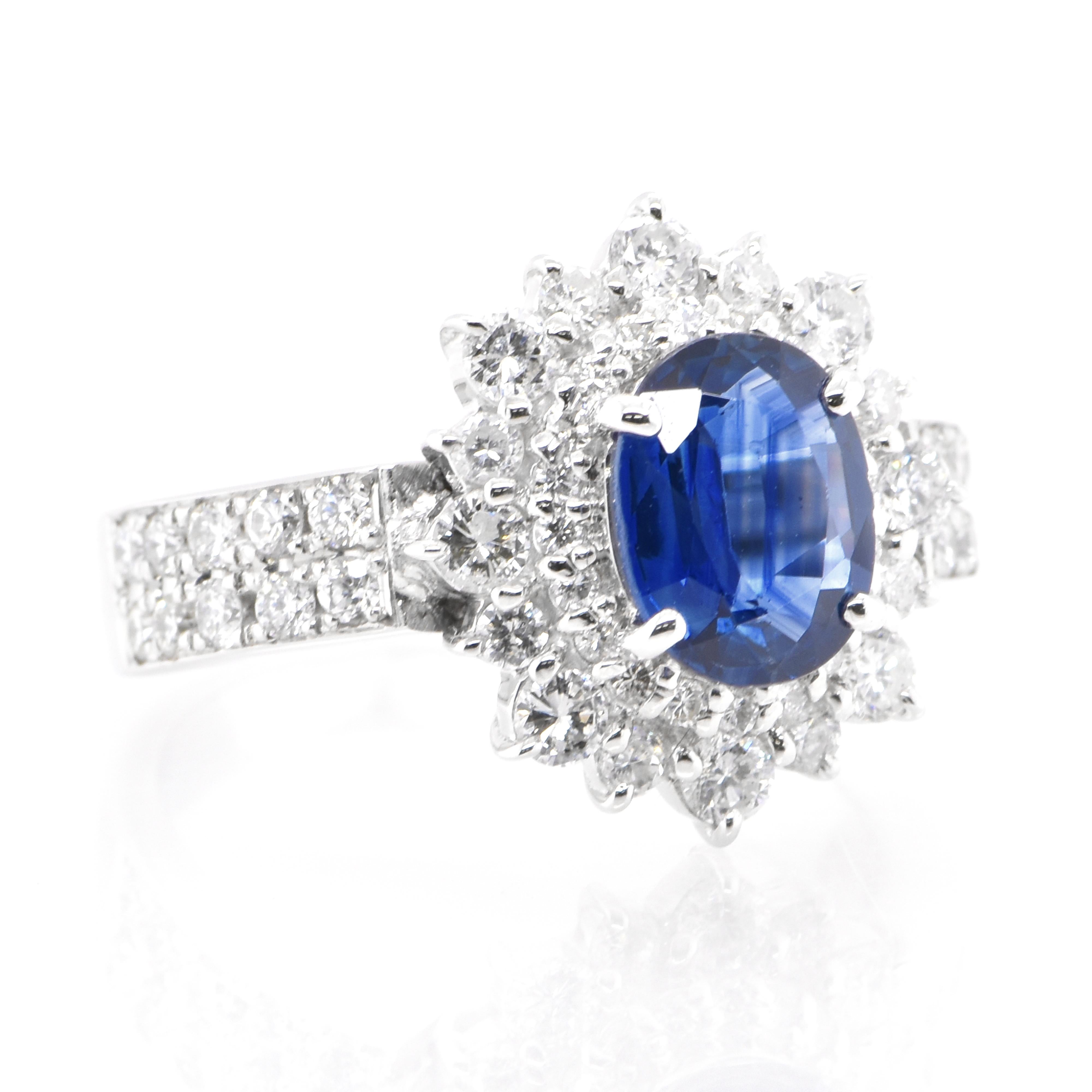 Modern 1.03 Carat Natural Blue Sapphire and Diamond Double Halo Ring Made in Platinum For Sale