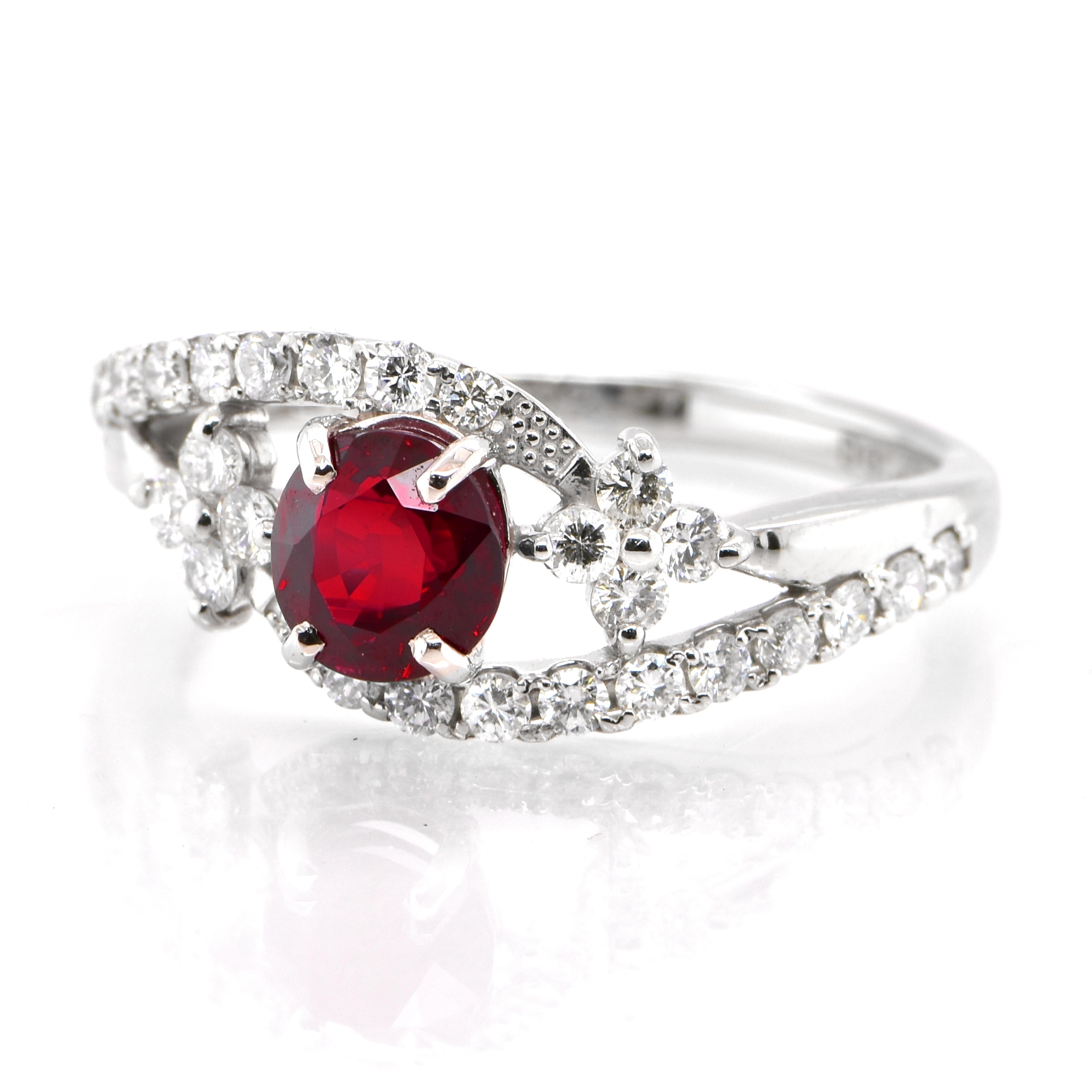 A beautiful Ring set in Platinum featuring a 1.032 Carat Natural Ruby and 0.47 Carat Diamonds. Rubies are referred to as 