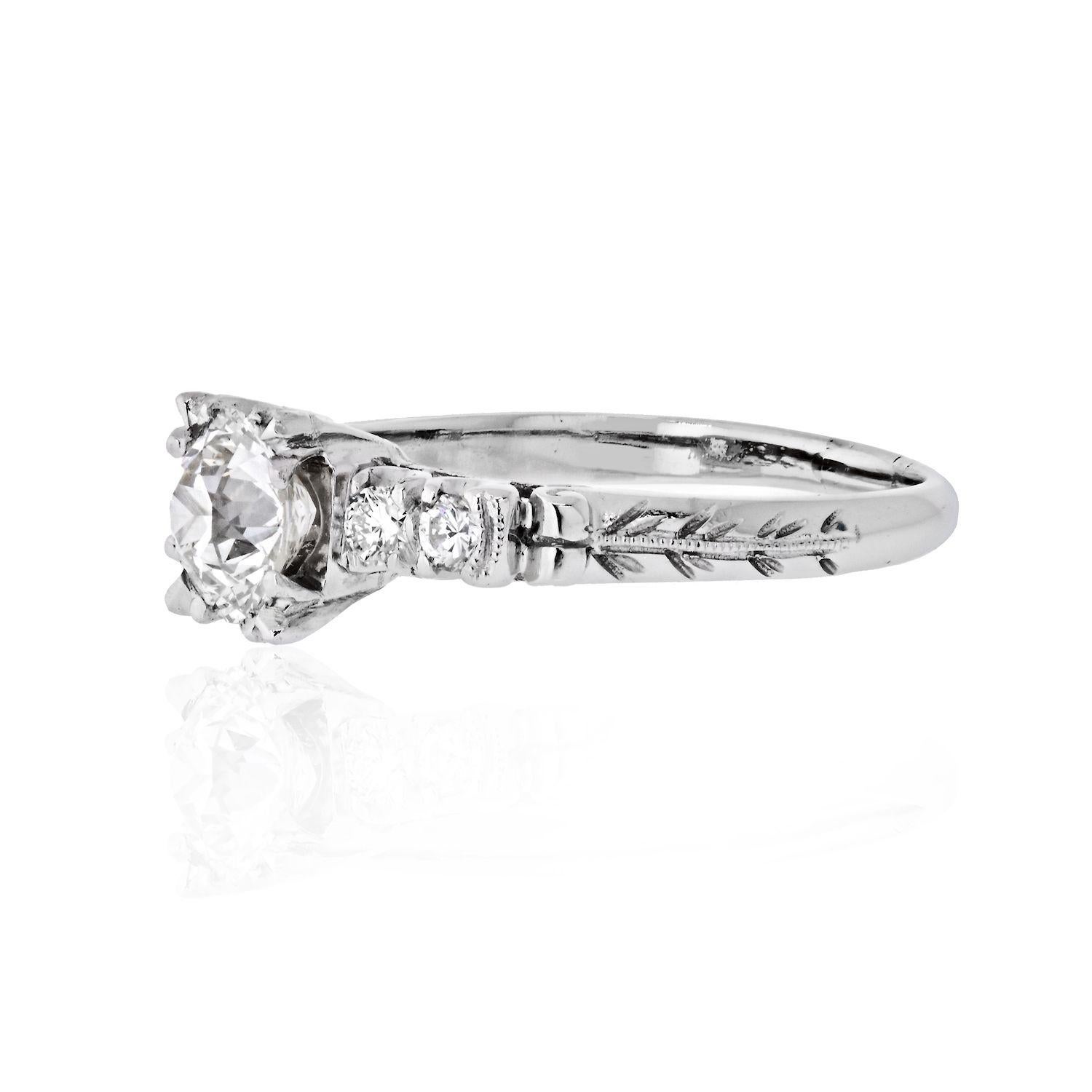 This is a beautiful 1.03 carat Old European Cut diamodn engagement ring. Center diamond is GIA certified J color, VS2 clarity. The shank of the ring is accented by round cut diamonds of an approx. 0.10cts. and vintage hand engraving.
