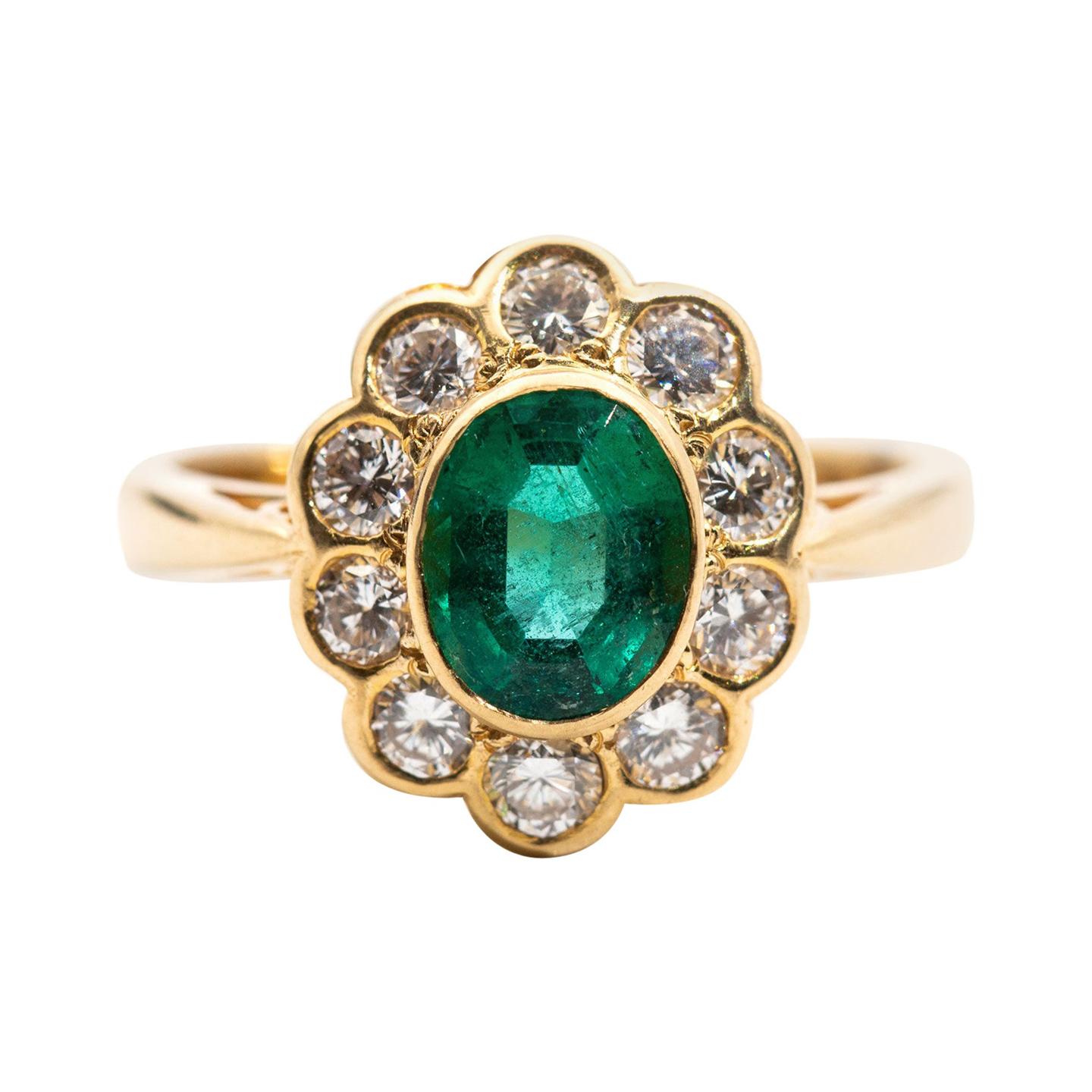 1.03 Carat Oval Emerald and Diamond 18 Carat Yellow Gold Vintage Cluster Ring