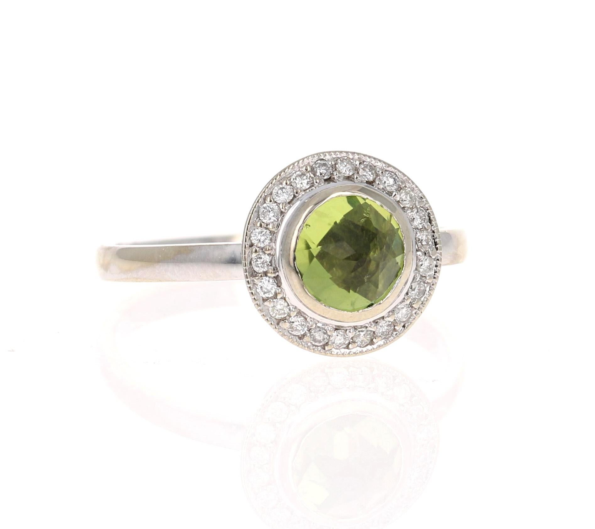 A cute and dainty Peridot ring accented with some Diamonds!

This cute ring has a Round Cut Peridot that weighs 0.89 Carats and is surrounded by a beautiful halo of 22 Round Cut Diamonds that weigh 0.14 Carats. (Clarity: SI, Color: F) The total