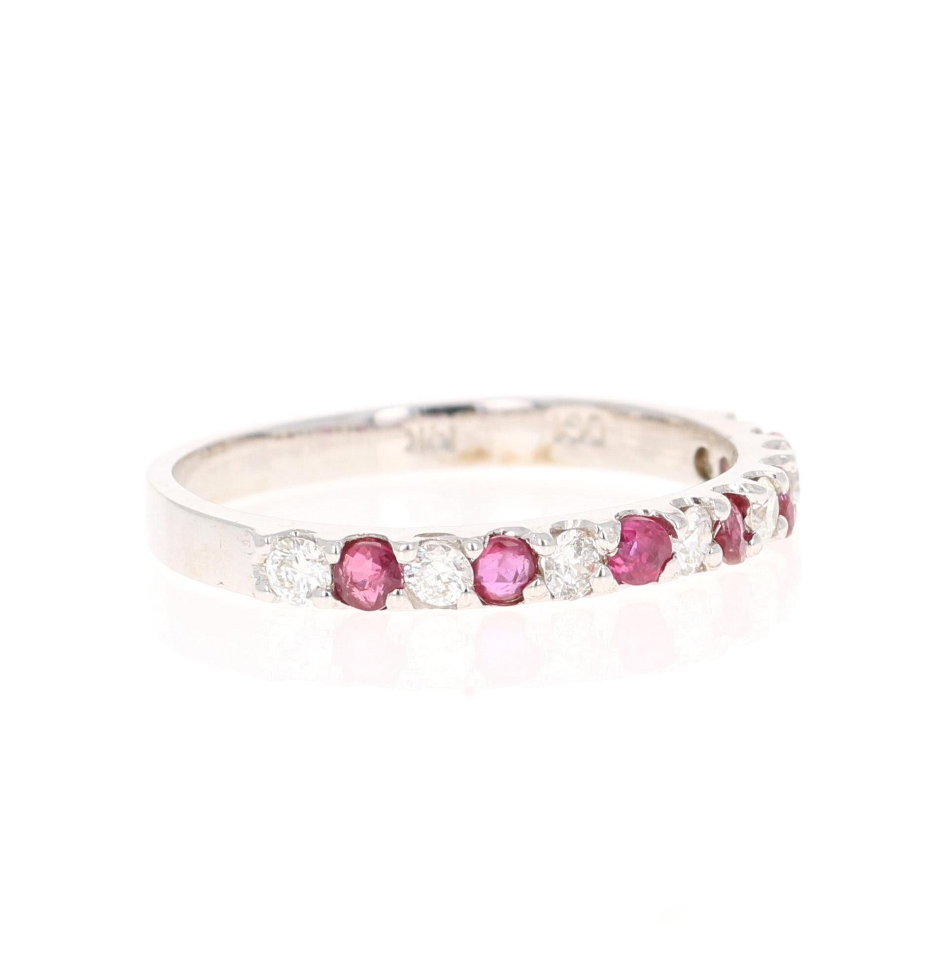 This is a classic band that is a must-have!
It has 6 Rubies that weigh 0.58 Carats and 7 Round Cut Diamonds that weigh 0.45 Carats. (Clarity: SI, Color: F) The Total Carat Weight of the Band is 1.03 Carats
It is made in 14K White Gold and weighs 1.6