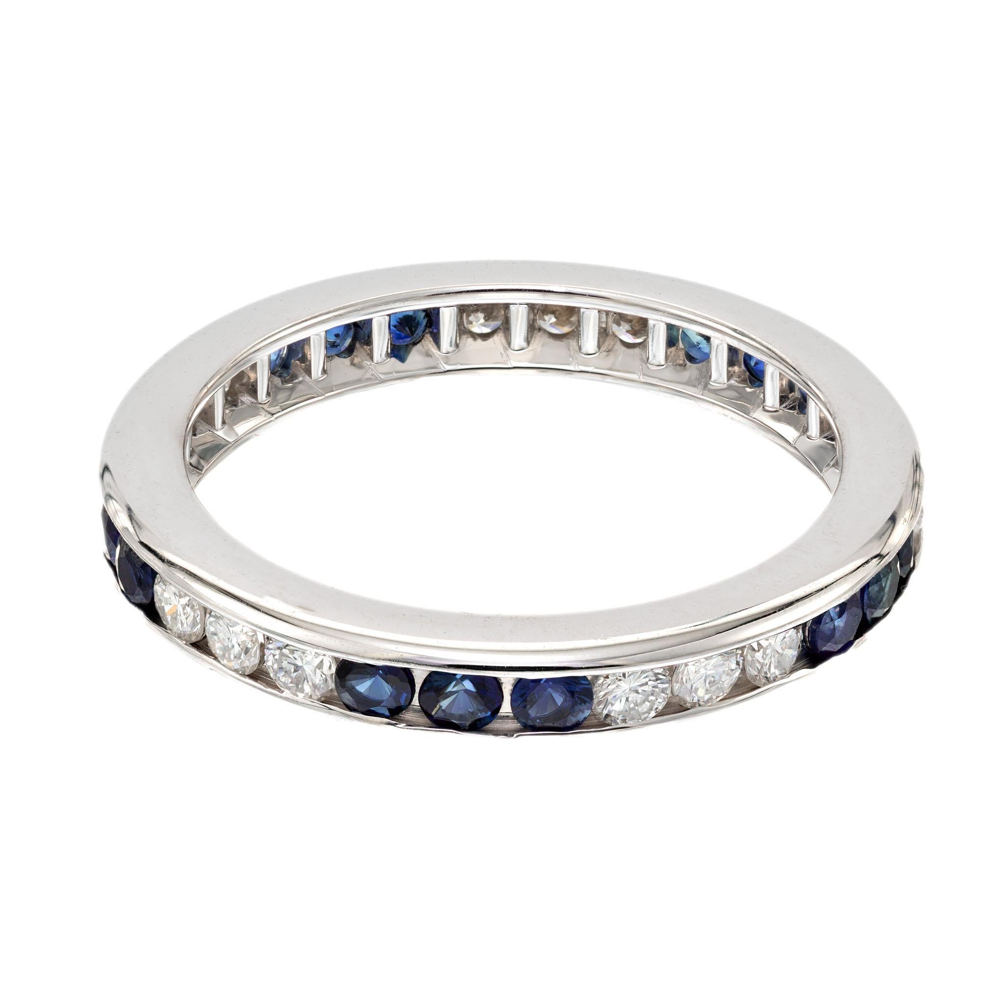 Sapphire and diamond wedding band ring. 15 round diamonds and sapphires, grouped by three, set in a 14k white gold setting. 

15 round diamonds, approx. total weight .53cts  F VS
15 round sapphire approx. total weight .50cts
Size: 6 and
