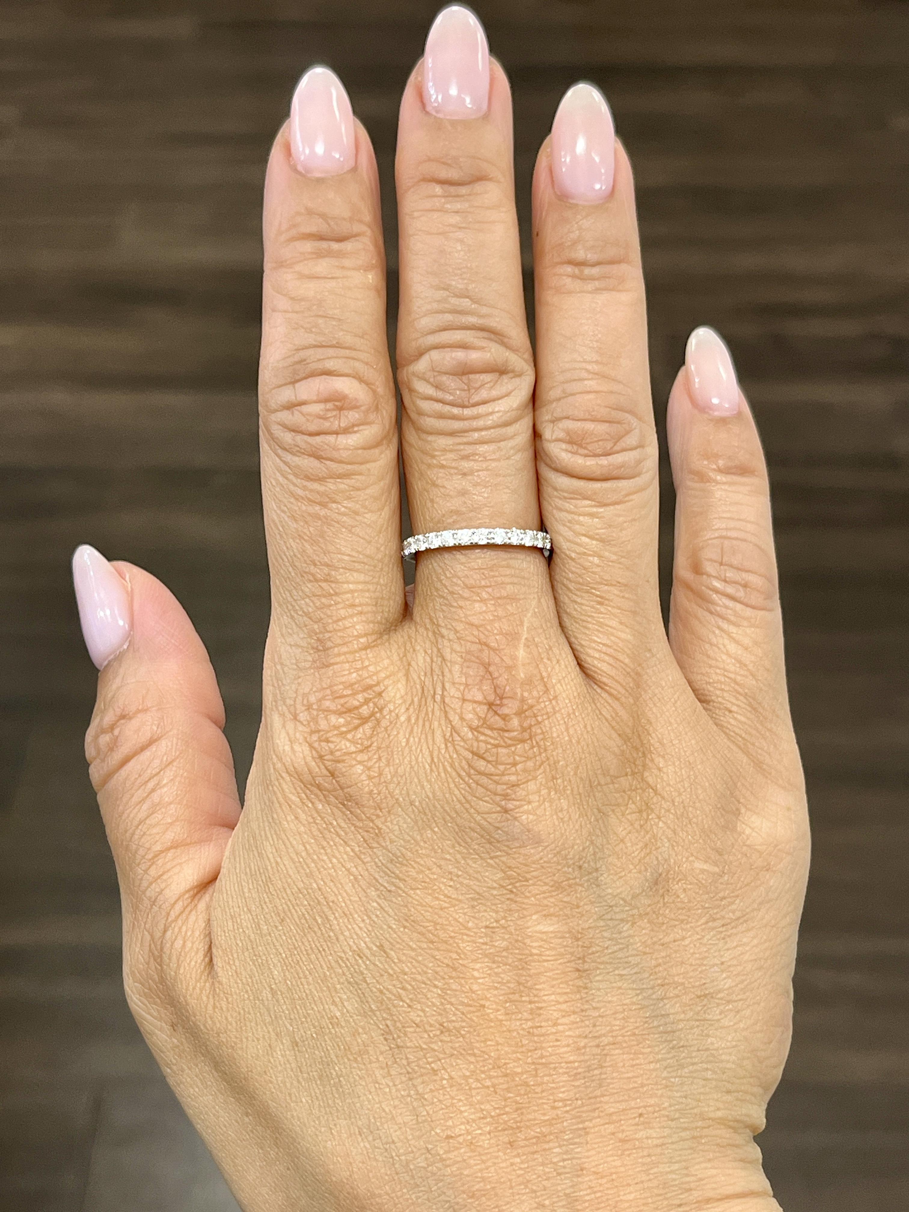 This beautiful eternity ring features 26 round brilliant diamonds all around. The diamonds showcase a color of E/F and VS1/VS2 in clarity. A lovely ring to adorn anyone's finger.