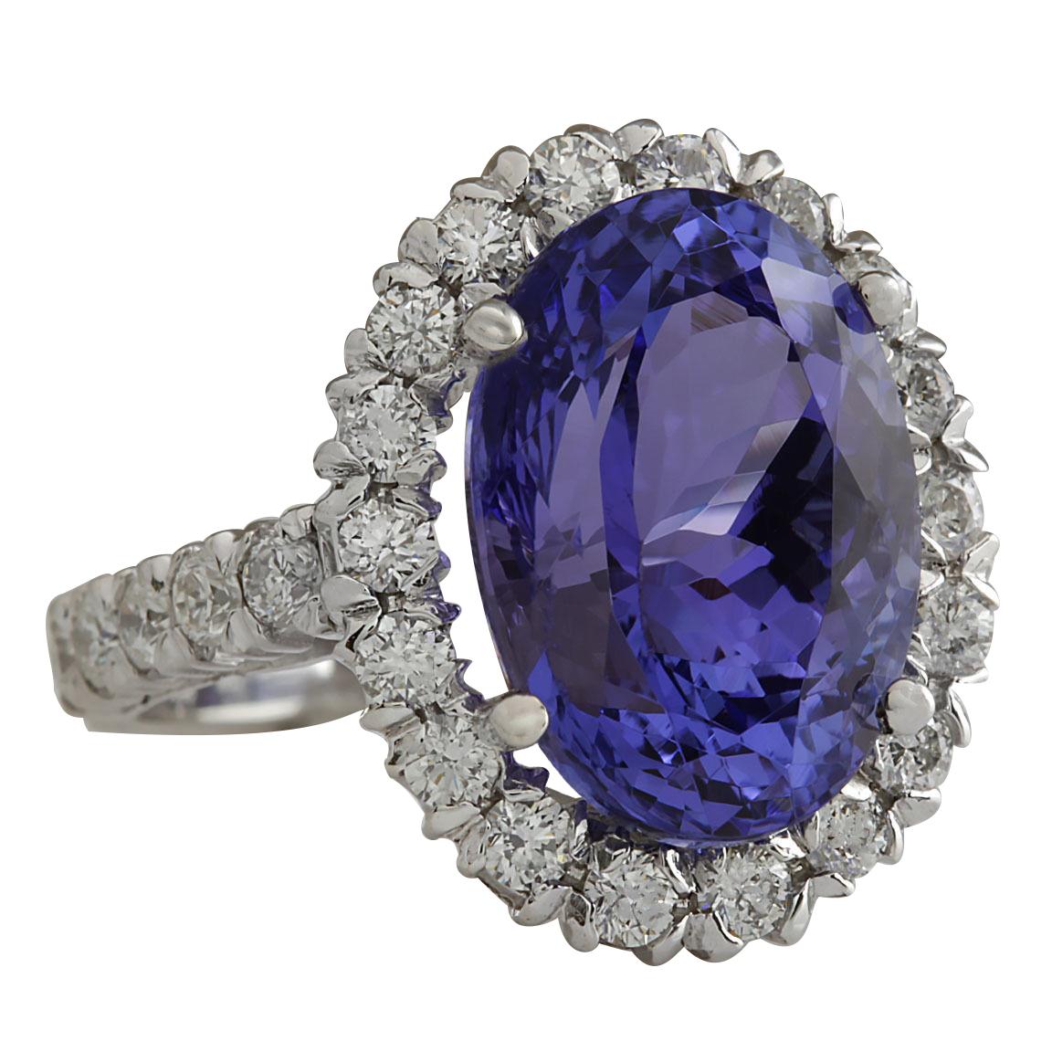 Stamped: 14K 
Total Gold Weight: 5.65 Grams
Total Natural Tanzanite Weight is 9.10 Carat (Measures: 14.00x10.00 Millimeters)
Color: Blue
Total Natural Diamond Weight is 1.20 Carat
Color: F-G, Clarity: VS2-SI1
Ring Face Dimensions:  19.15x15.85
