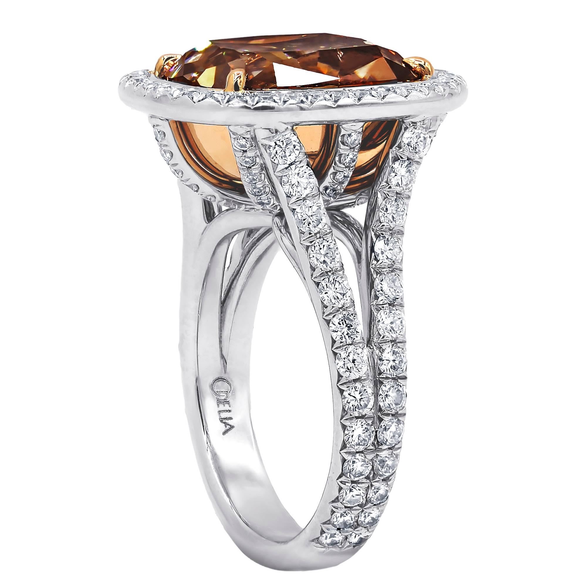 Platinum and 18KT Magnificent diamonds ring with 10.30 carats Fancy Orange Brown, set with 1.60 carats of round cut diamonds. 